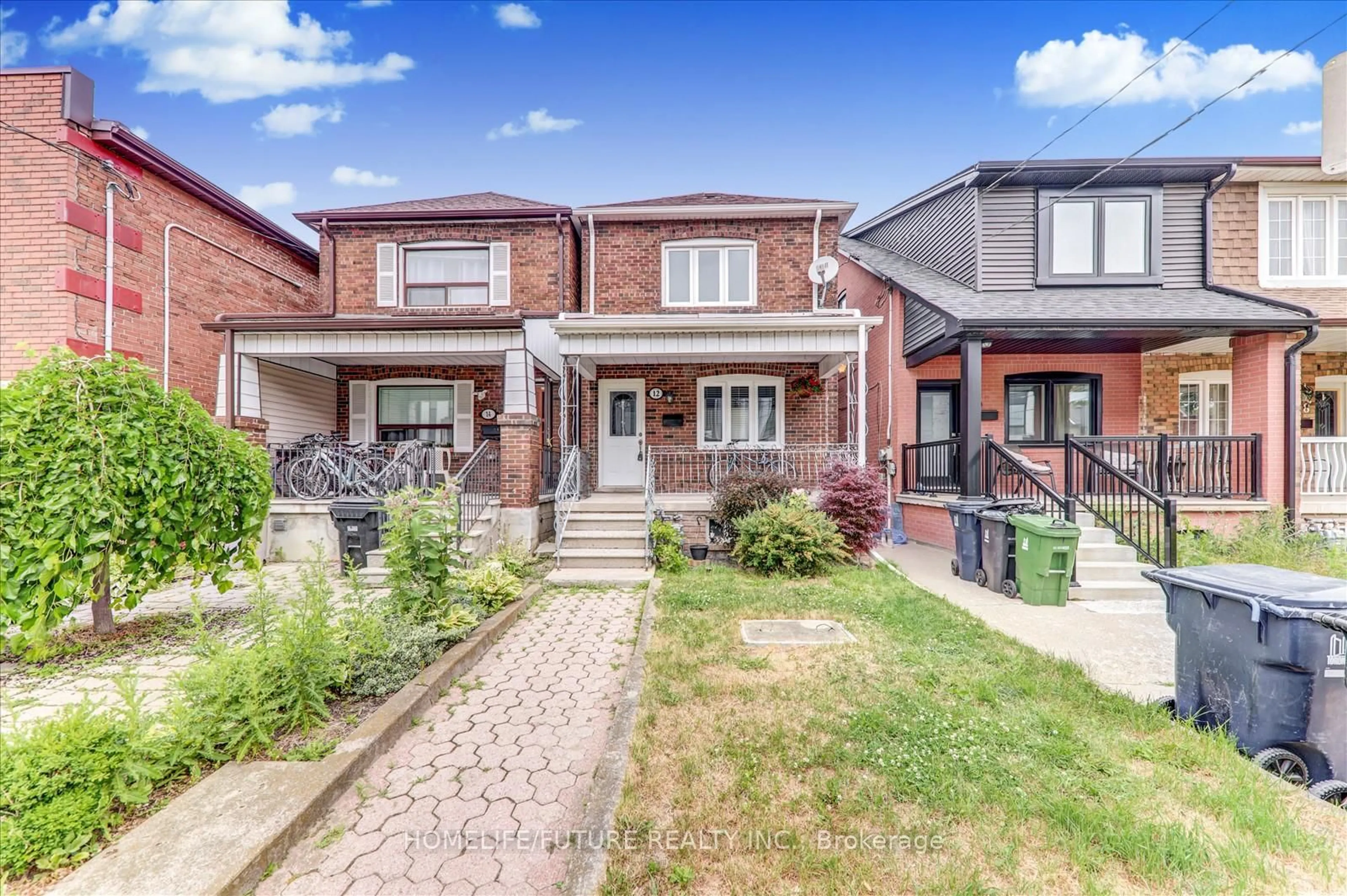 Home with brick exterior material, street for 12 Innes Ave, Toronto Ontario M6E 1M8