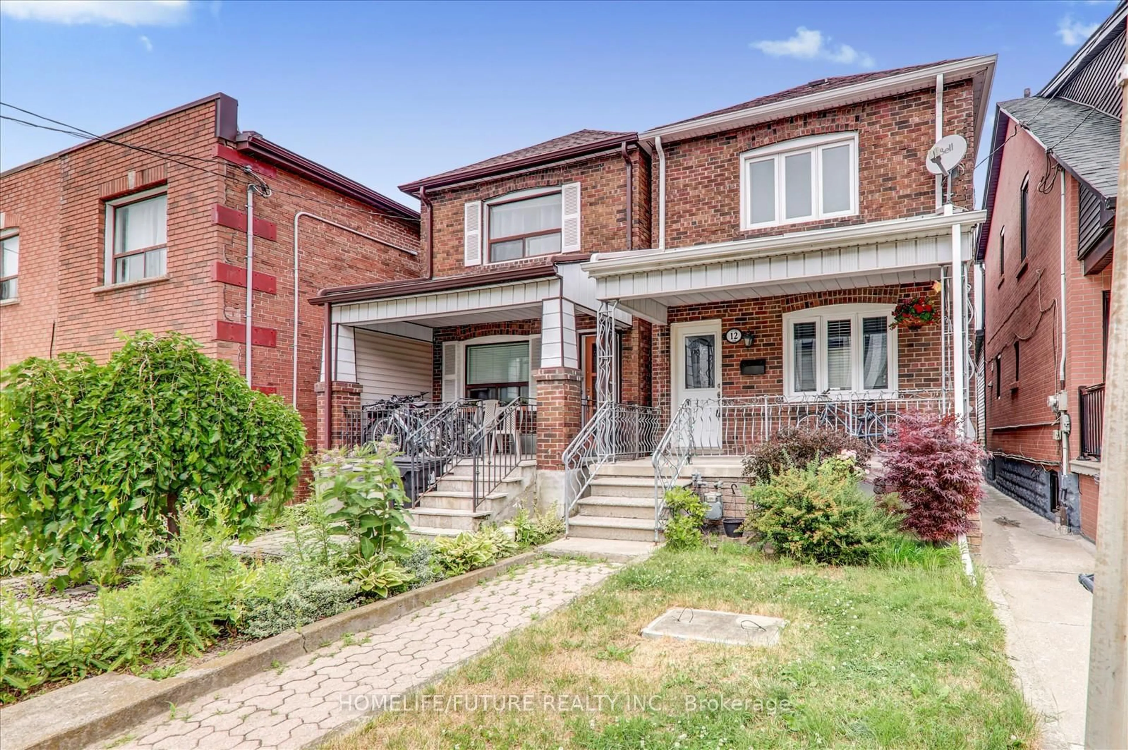 Home with brick exterior material, street for 12 Innes Ave, Toronto Ontario M6E 1M8