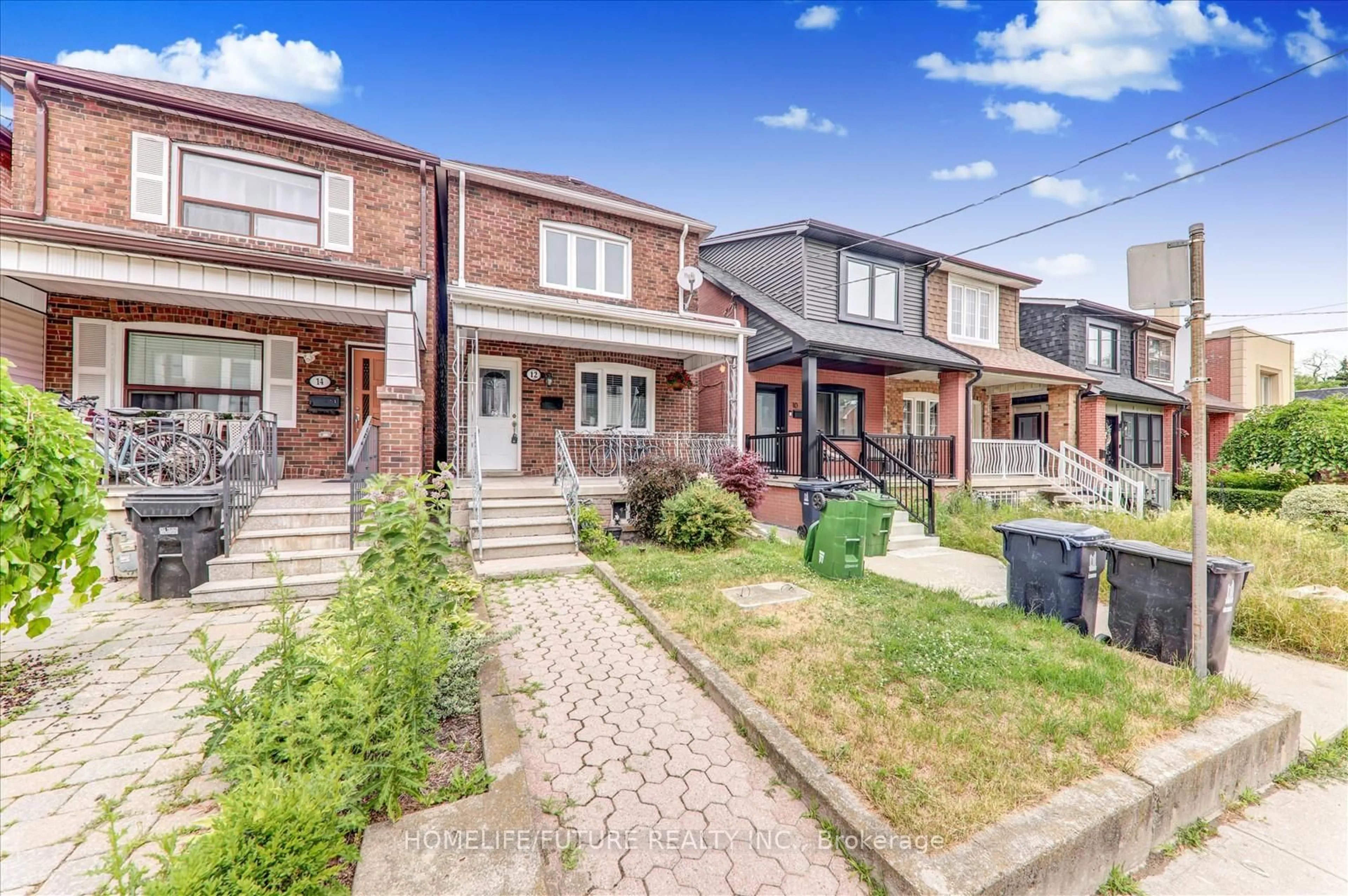 Home with brick exterior material, street for 12 Innes Ave, Toronto Ontario M6E 1M8