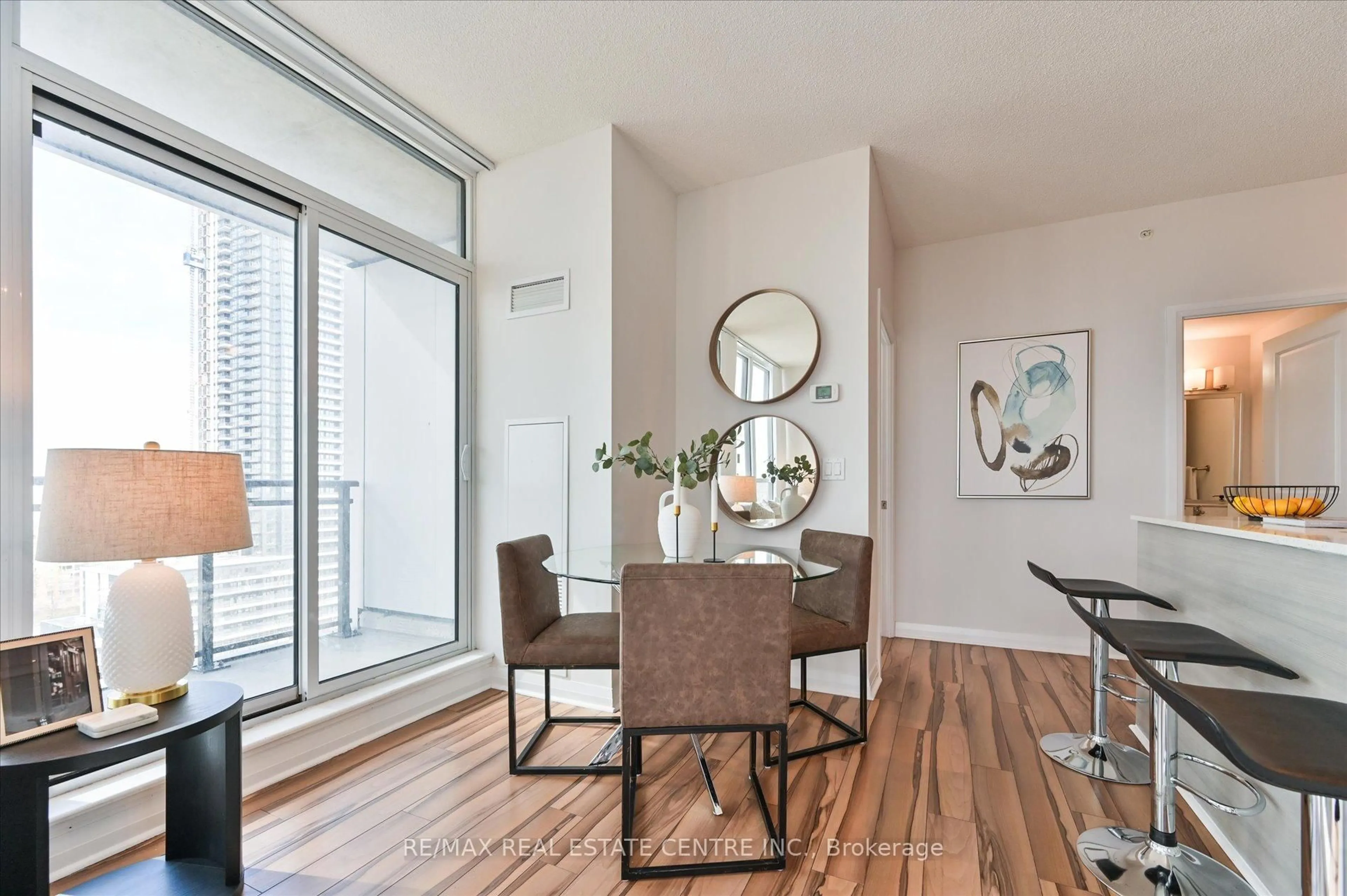 Dining room, wood/laminate floor for 55 Eglinton Ave #1402, Mississauga Ontario L5R 0E4