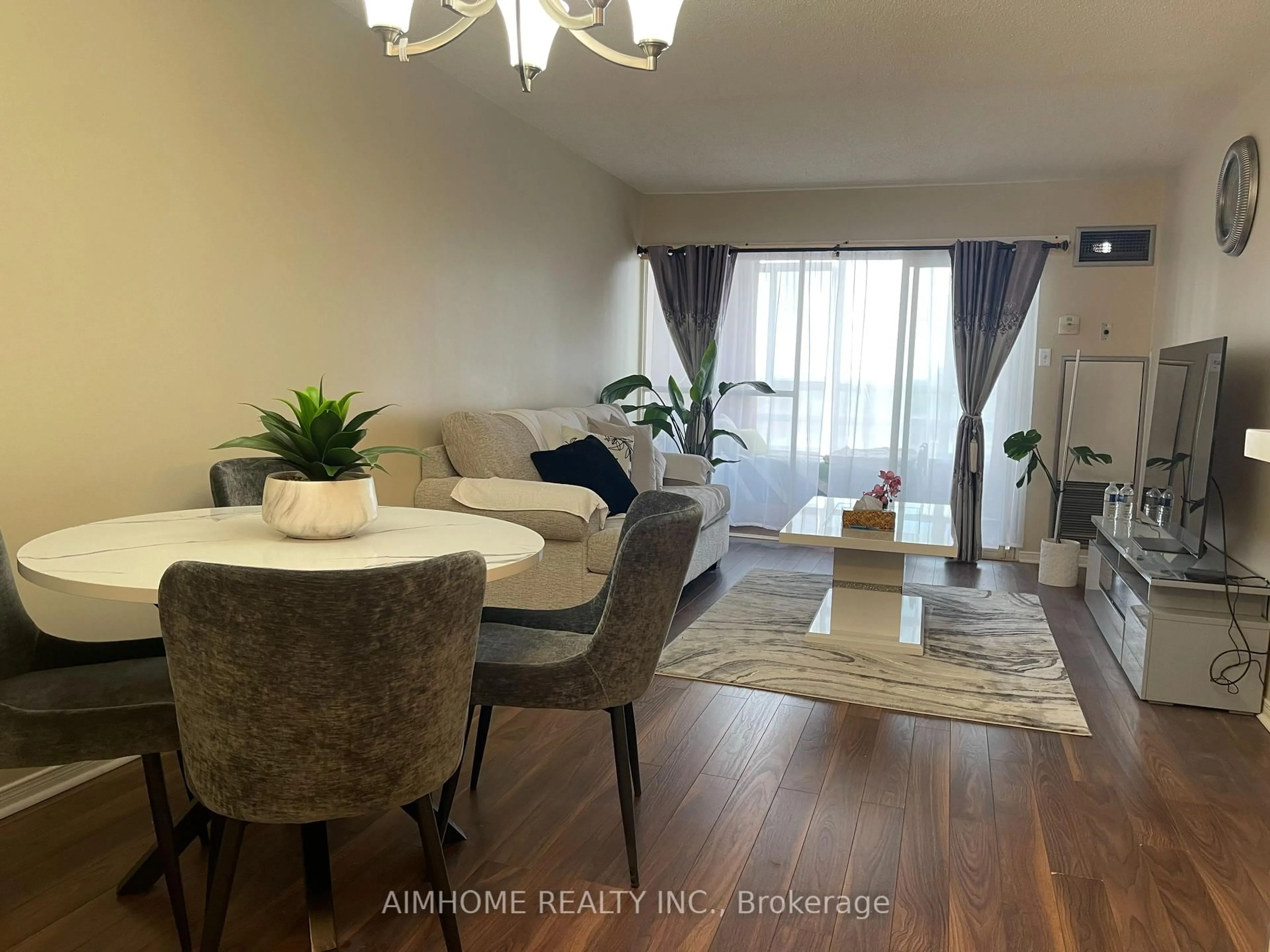 Living room with furniture, wood/laminate floor for 75 King St #1104, Mississauga Ontario L5A 4G5