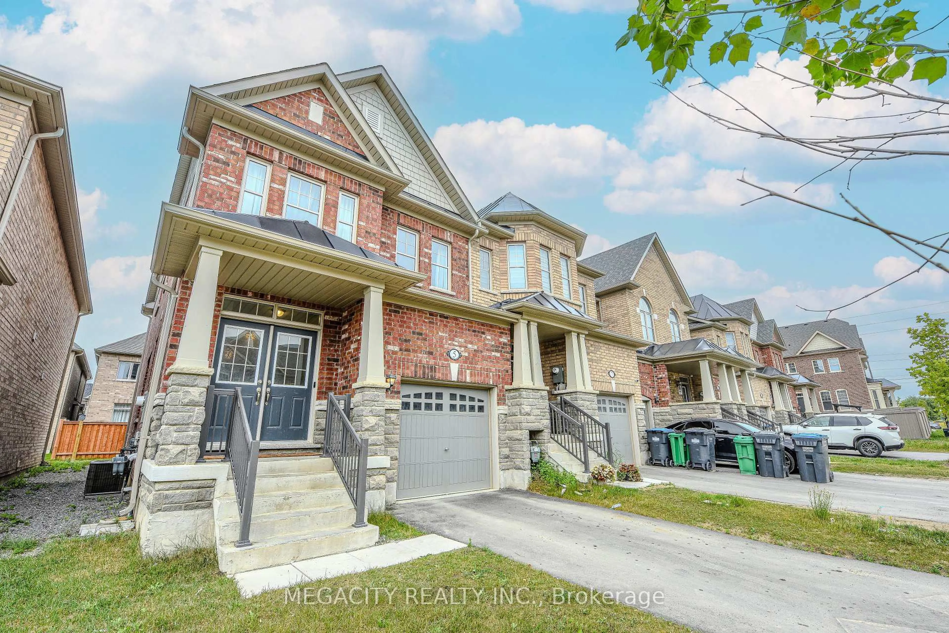 Home with brick exterior material, street for 5 Bushwood Tr, Brampton Ontario L7A 5J7
