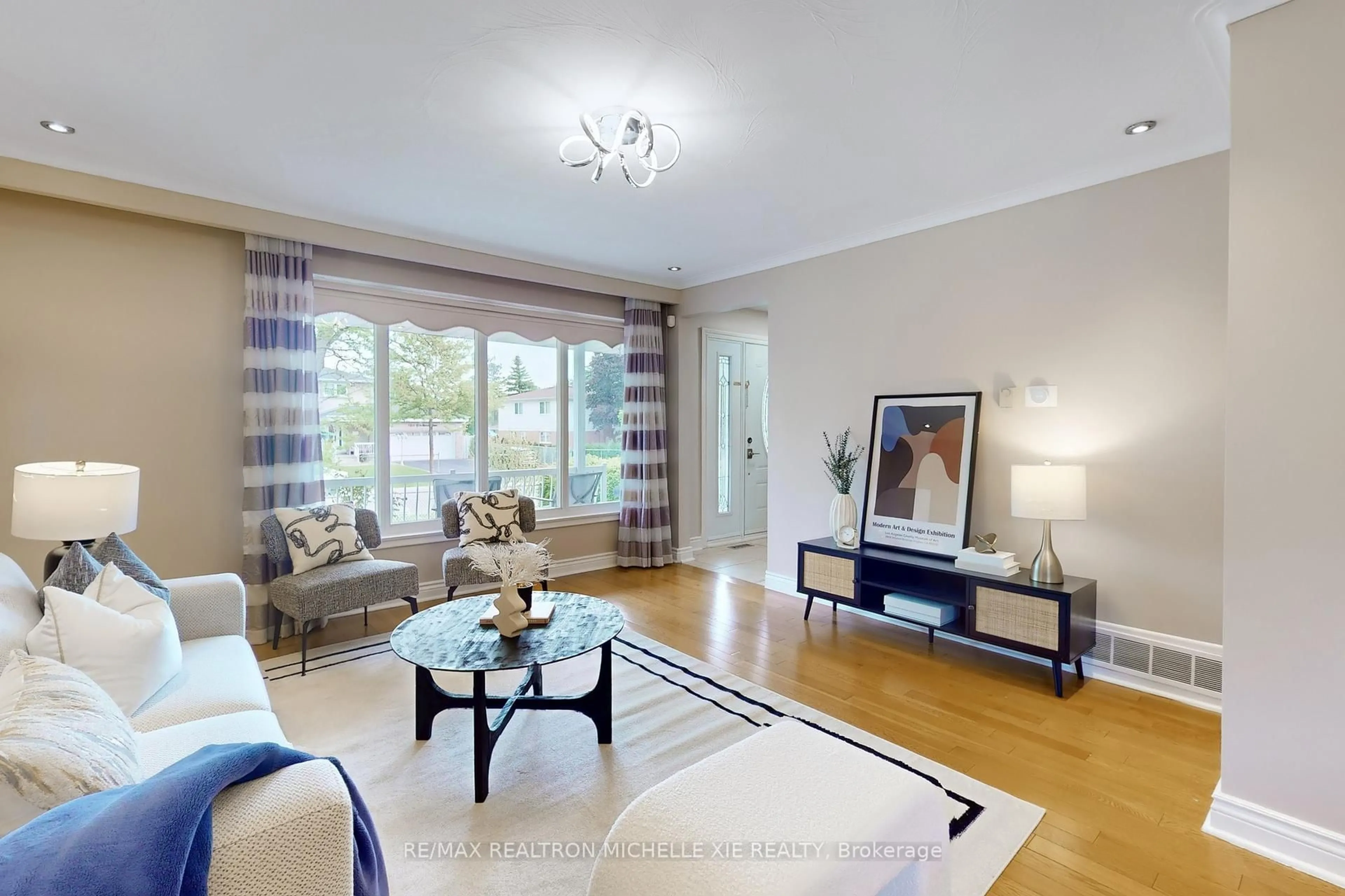 Living room with furniture, wood/laminate floor for 1205 Forestwood Dr, Mississauga Ontario L5C 1H6