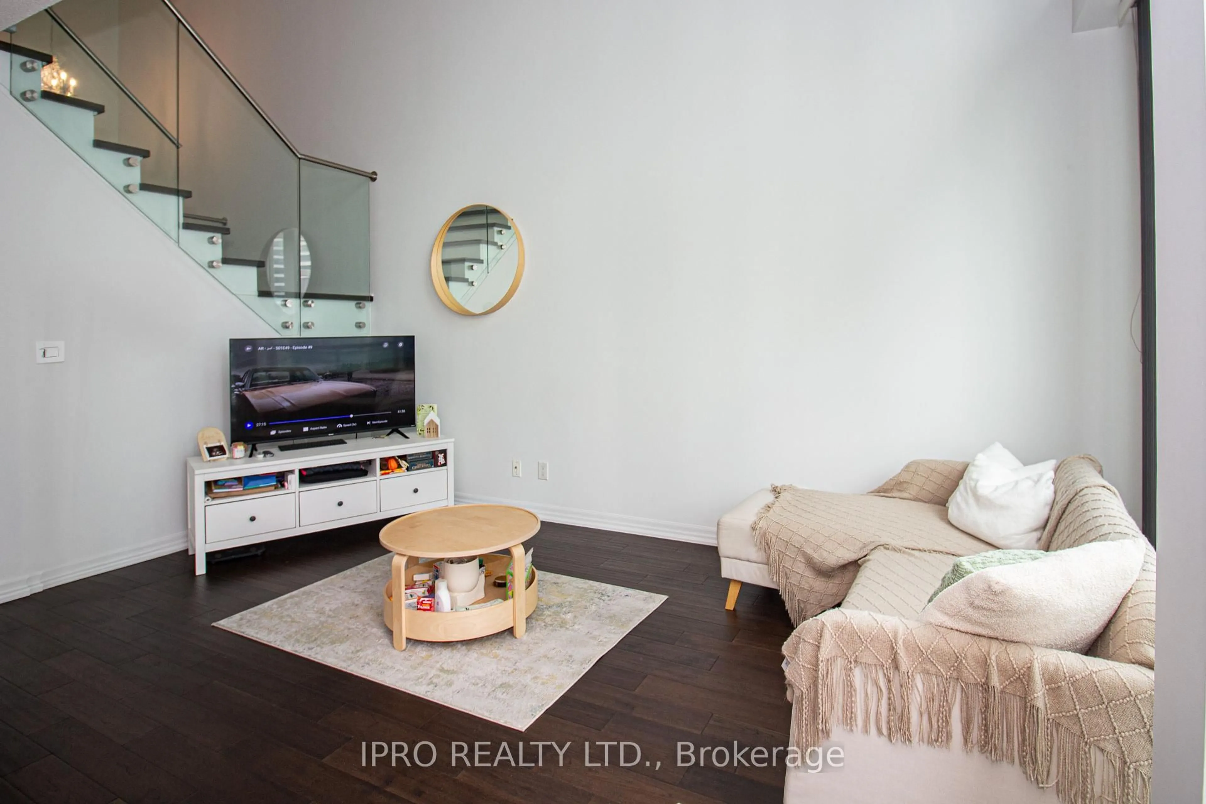 Living room with furniture, wood/laminate floor for 223 Webb Dr #1701, Mississauga Ontario L5B 0E8