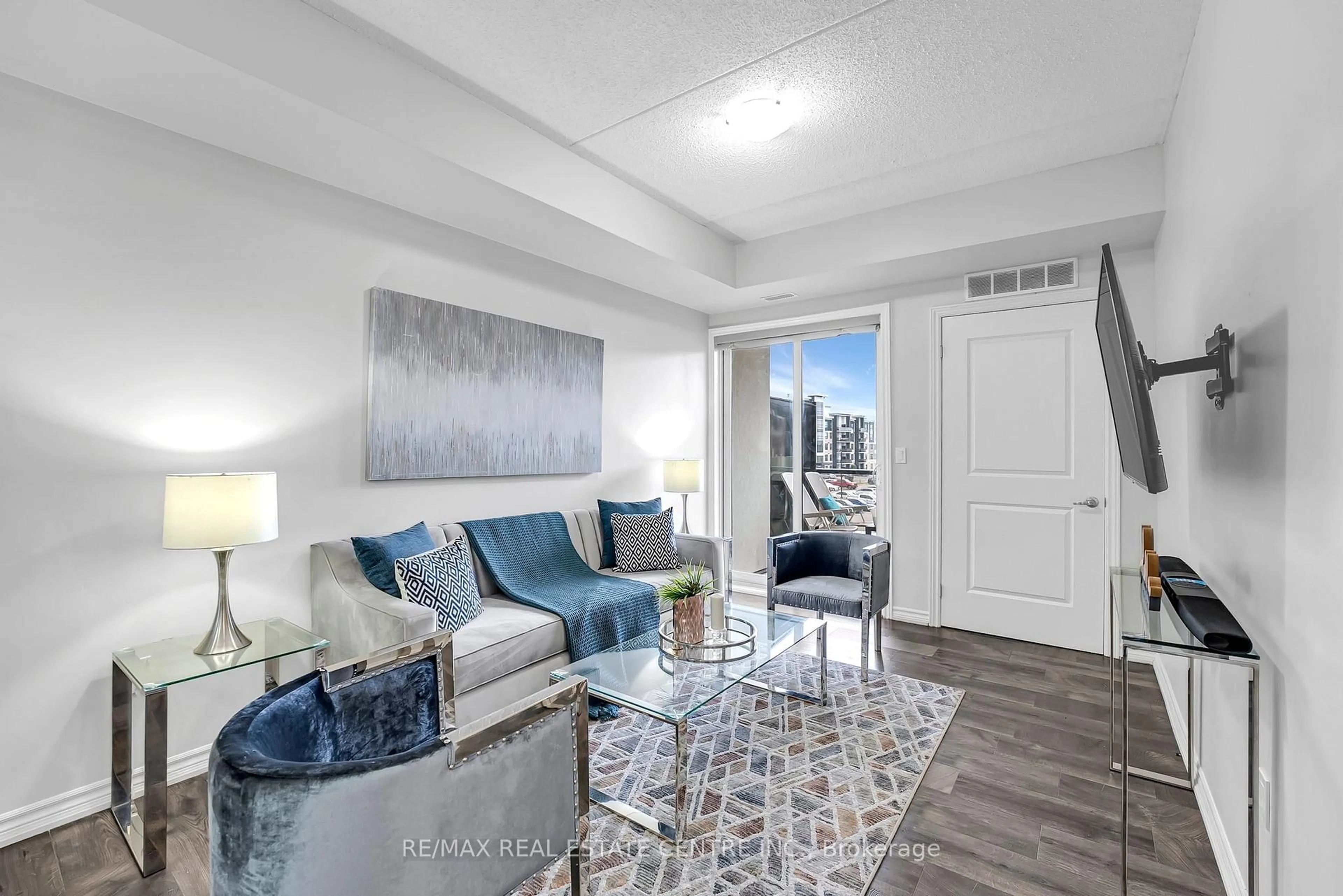 Living room with furniture, unknown for 640 Sauve St #316, Milton Ontario L9T 9A7