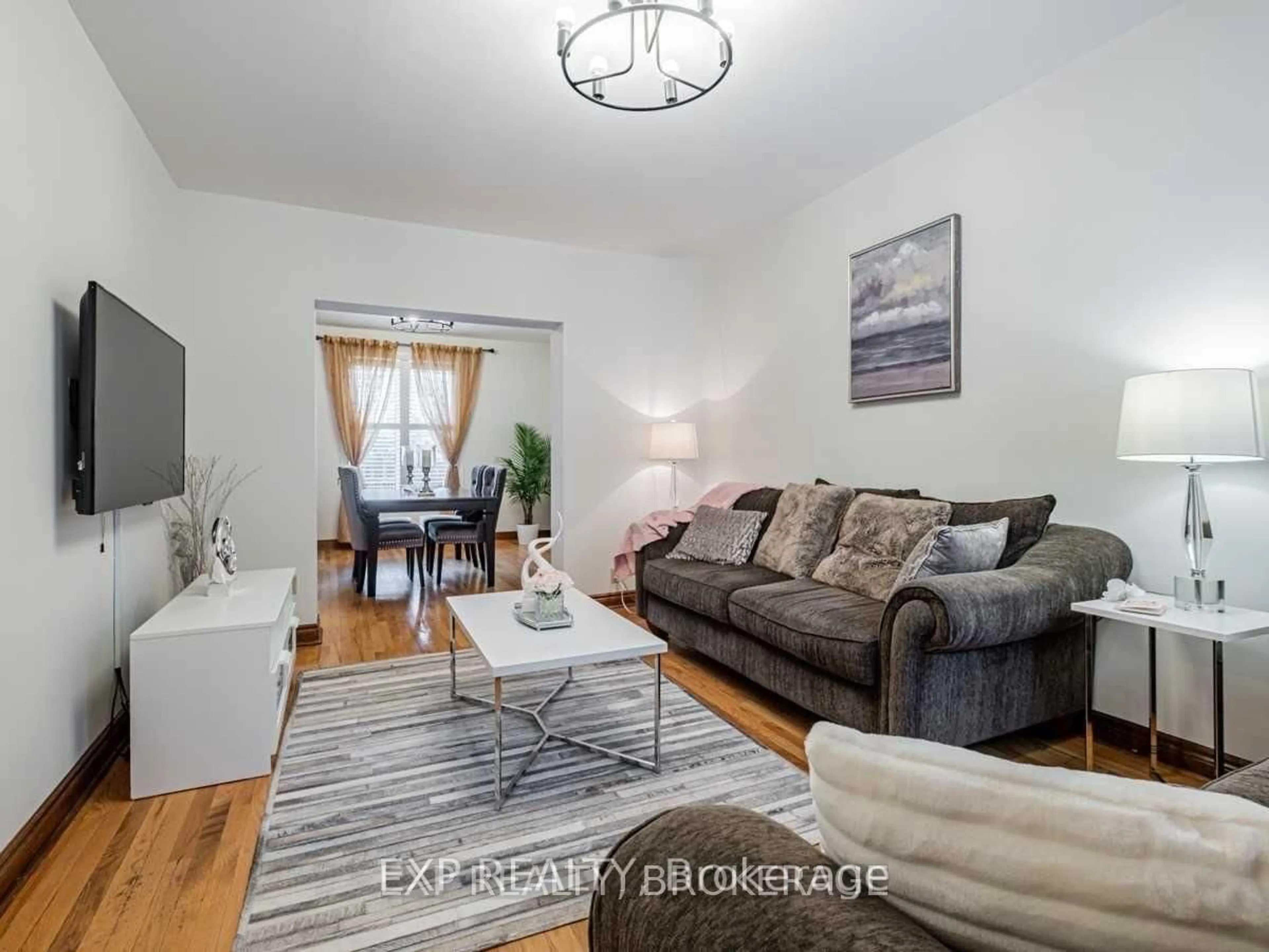 Living room with furniture, wood/laminate floor for 62 Aziel St, Toronto Ontario M6P 2N9