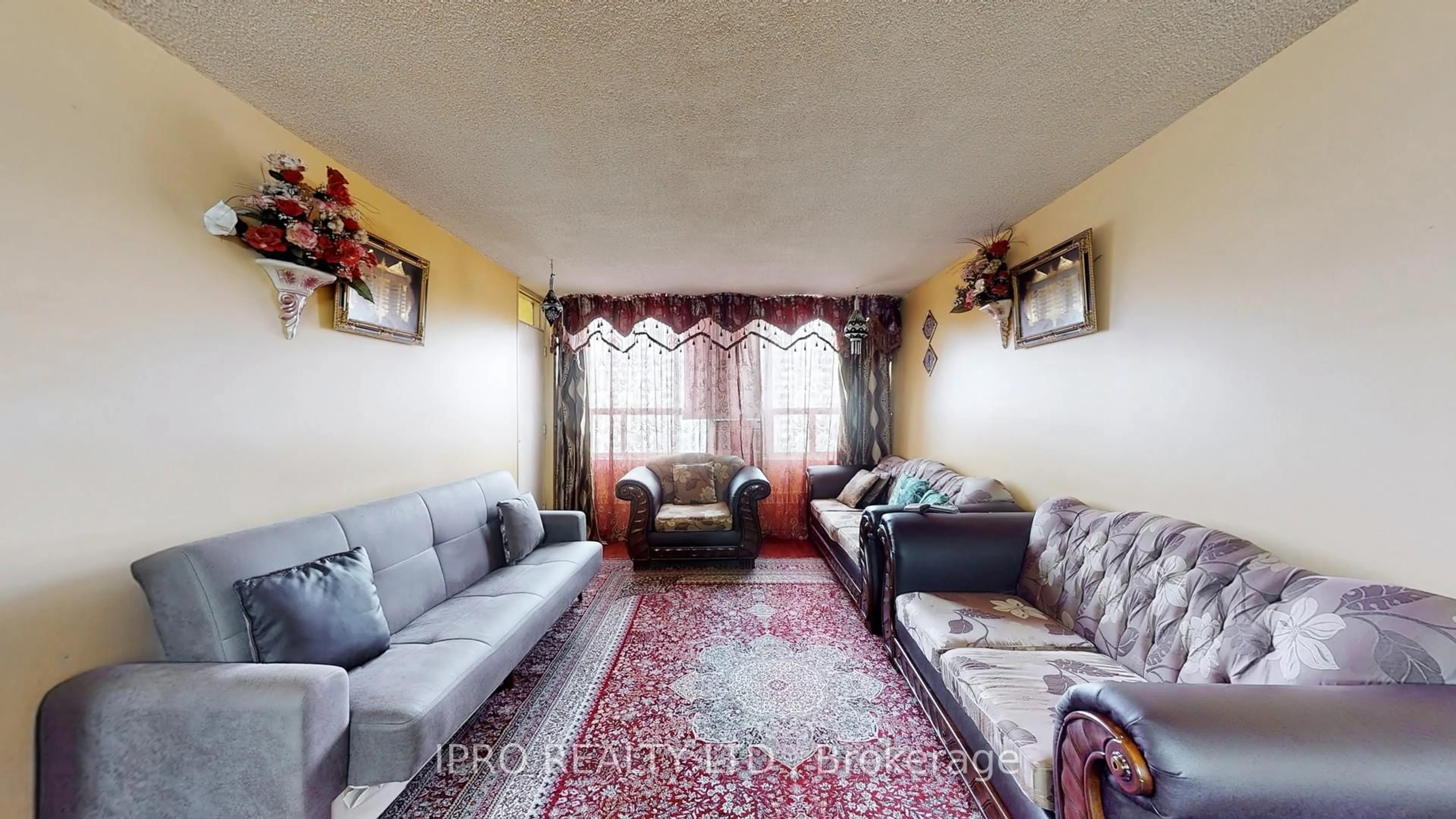 Living room with furniture, carpet floor for 370 Dixon Rd #810, Toronto Ontario M9R 1T2