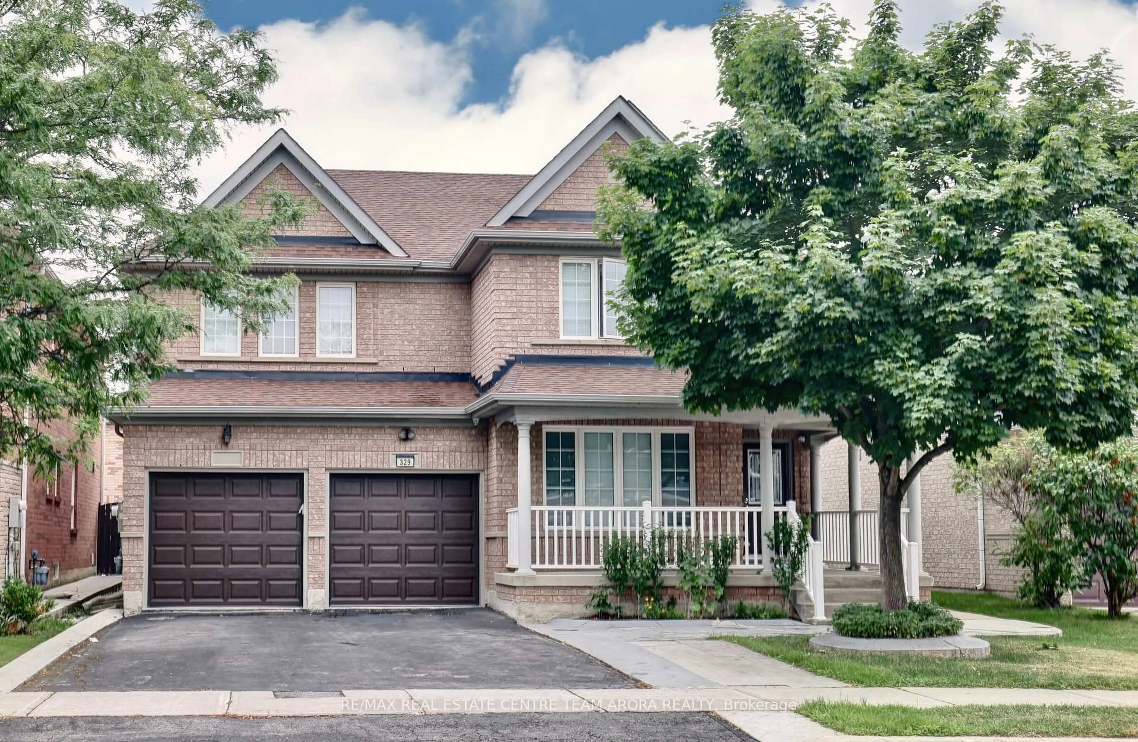 Home with brick exterior material, street for 329 Brisdale Dr, Brampton Ontario L7A 3C1