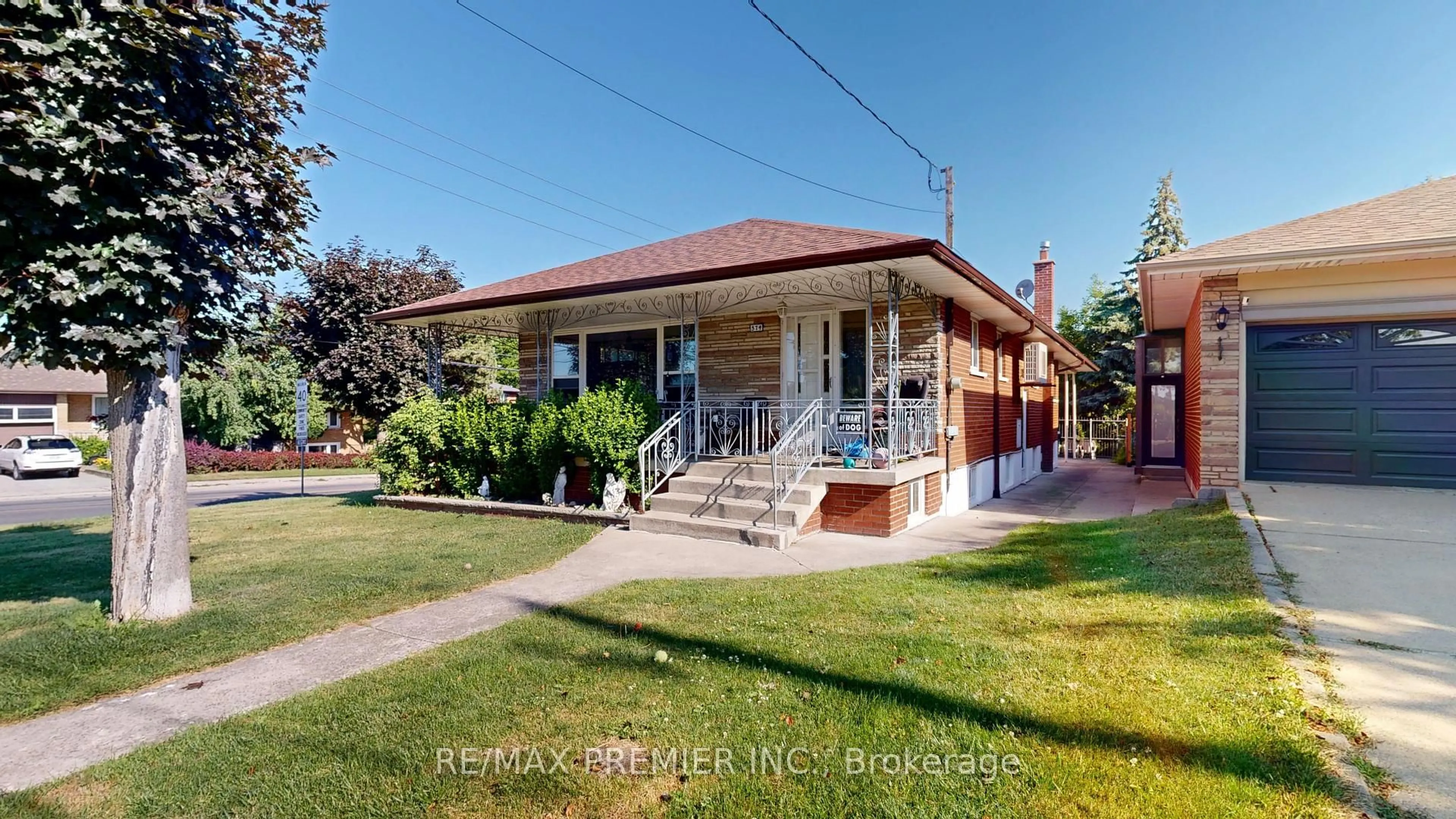 Home with brick exterior material, street for 574 Queens Dr, Toronto Ontario M6L 1N3