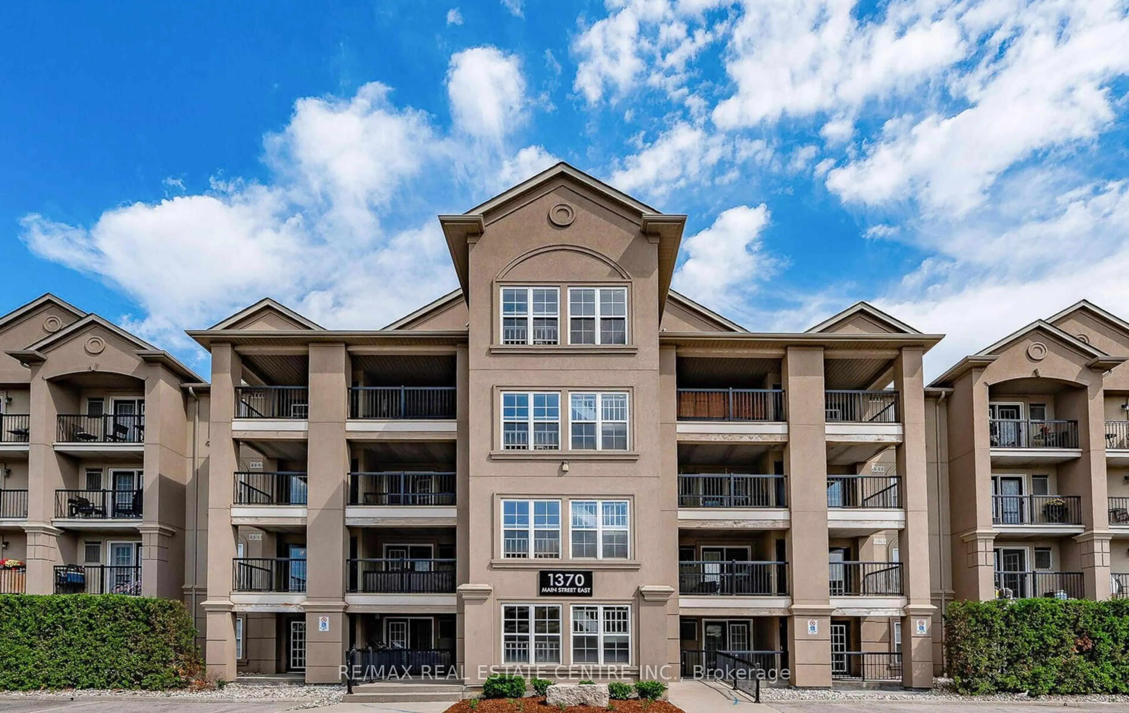 A pic from outside/outdoor area/front of a property/back of a property/a pic from drone, unknown for 1370 Main St #205, Milton Ontario L9T 7S8