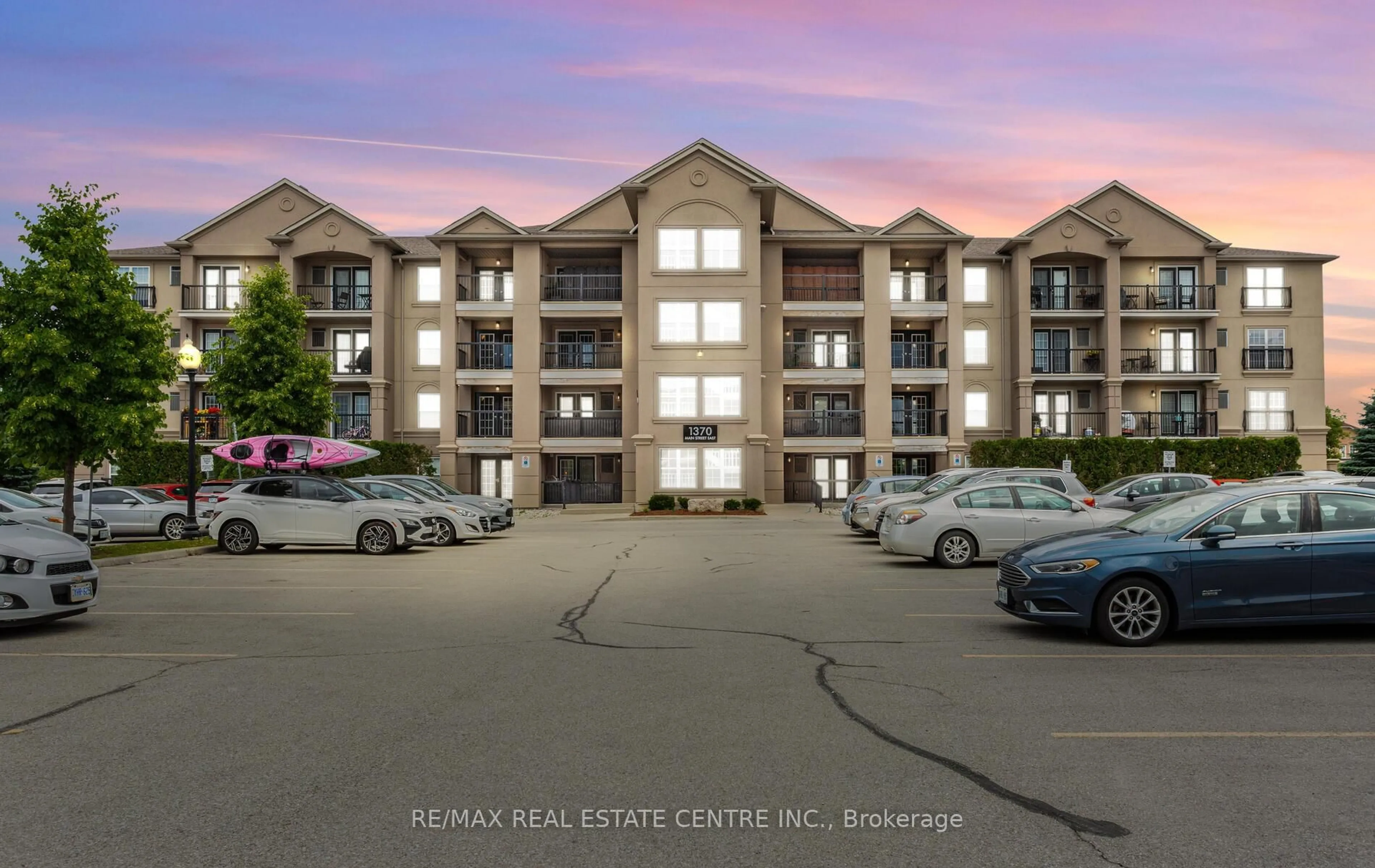 A pic from outside/outdoor area/front of a property/back of a property/a pic from drone, unknown for 1370 Main St #205, Milton Ontario L9T 7S8