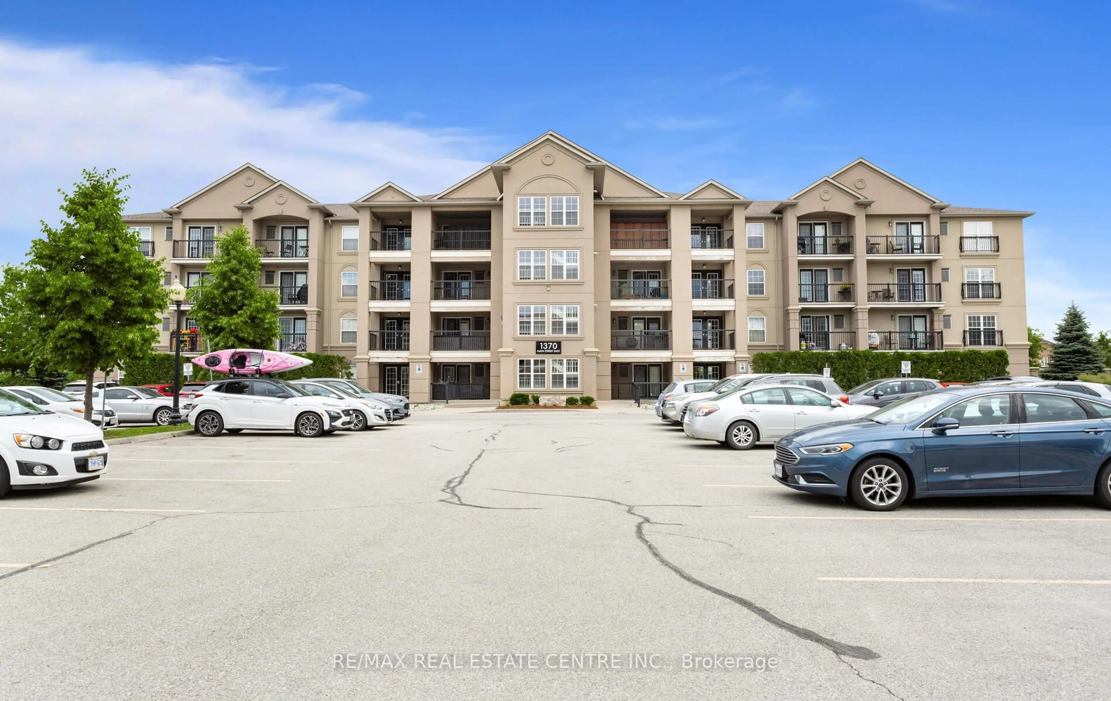 A pic from outside/outdoor area/front of a property/back of a property/a pic from drone, water/lake/river/ocean view for 1370 Main St #205, Milton Ontario L9T 7S8