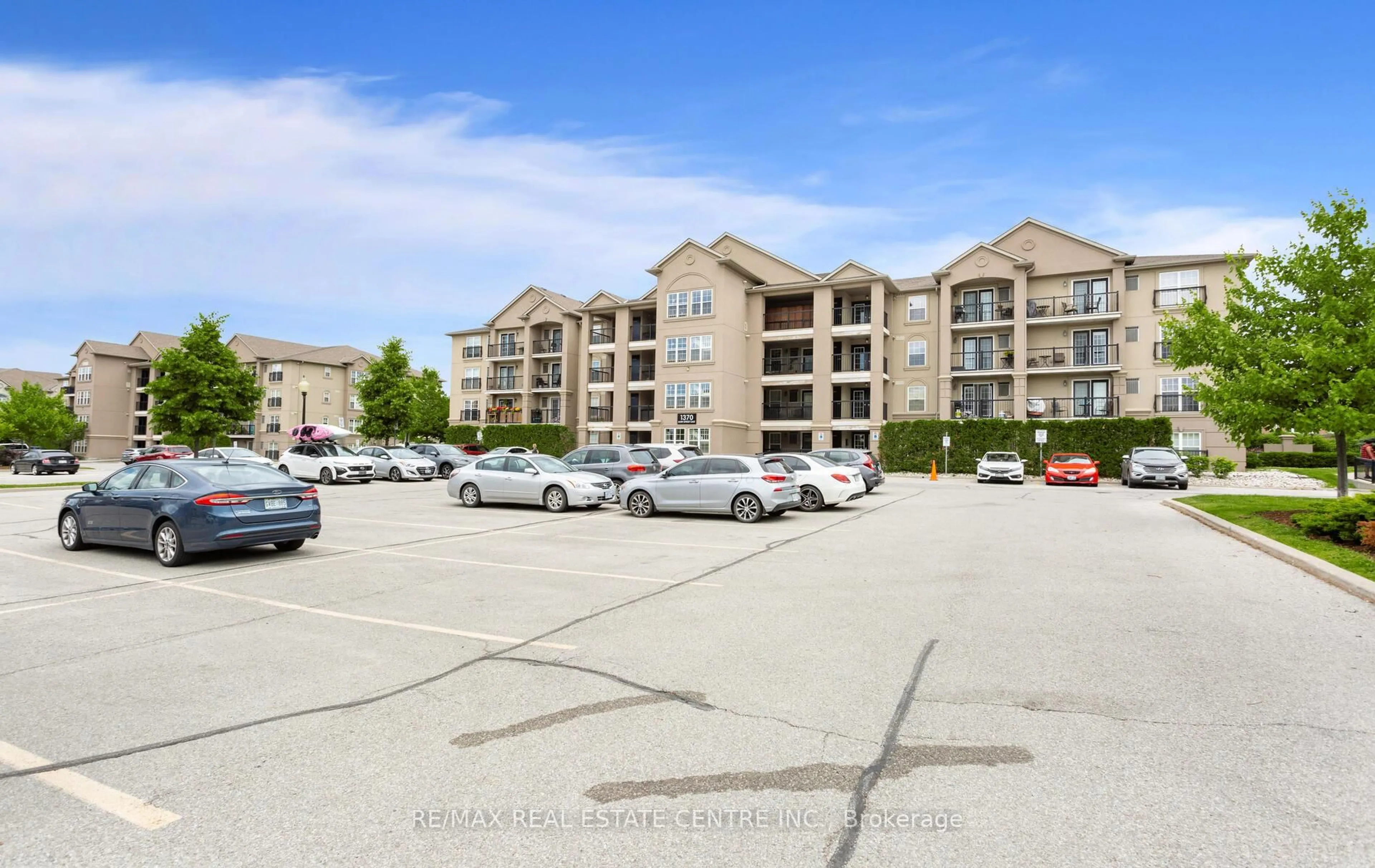 A pic from outside/outdoor area/front of a property/back of a property/a pic from drone, unknown for 1370 Main St #205, Milton Ontario L9T 7S8