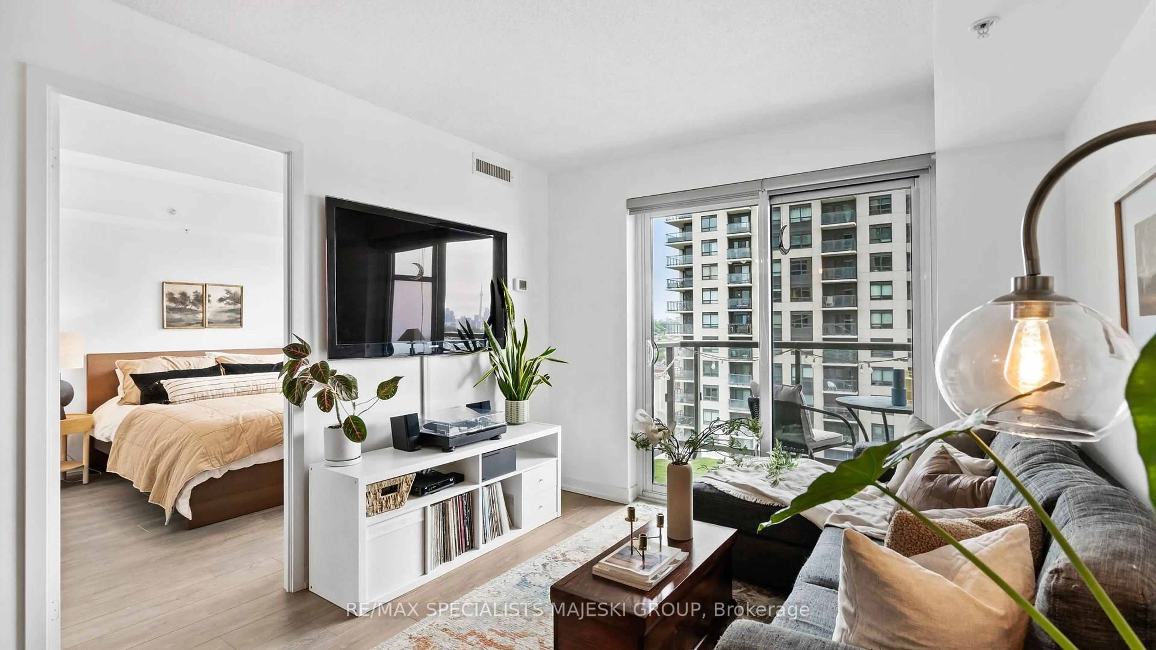 Living room with furniture, wood/laminate floor for 1420 Dupont St #1301, Toronto Ontario M6H 0C2