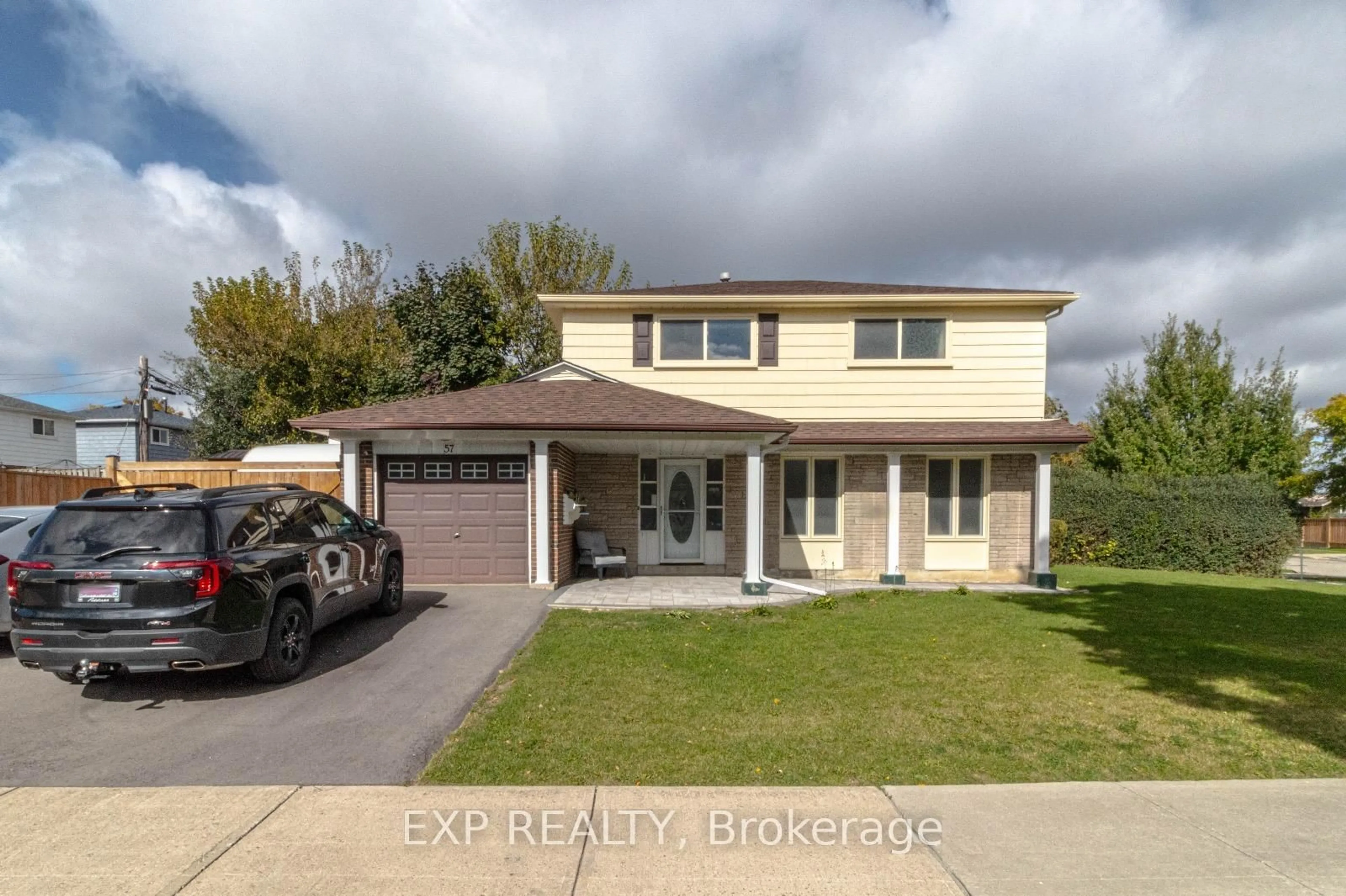 Home with vinyl exterior material, street for 57 Tealham Dr, Toronto Ontario M9V 3T7