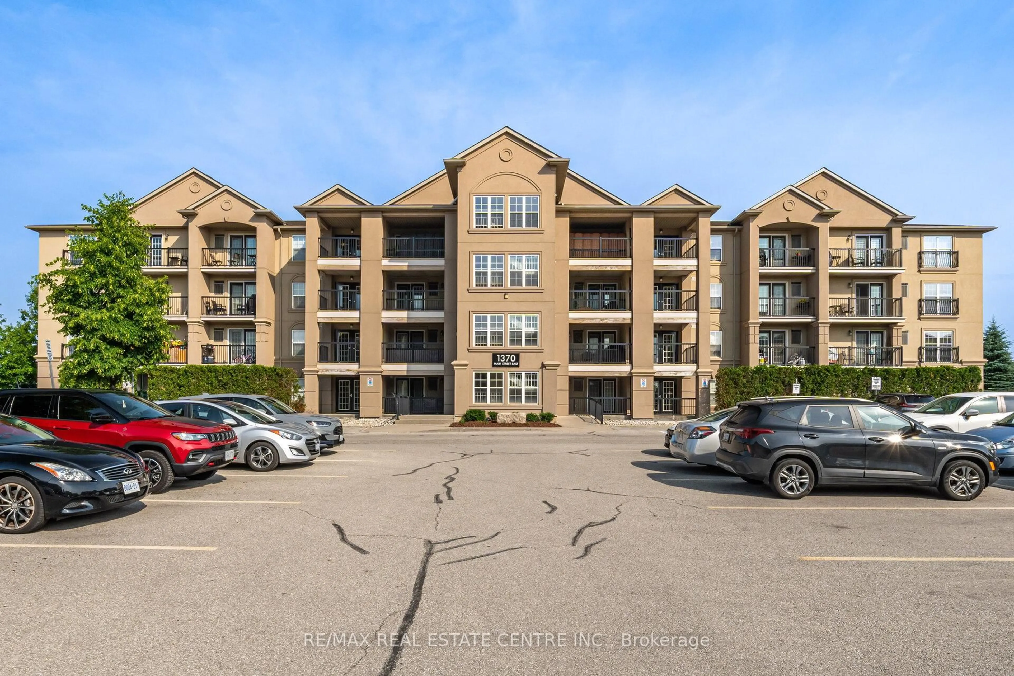 A pic from outside/outdoor area/front of a property/back of a property/a pic from drone, unknown for 1370 Main St #203, Milton Ontario L9T 7S8