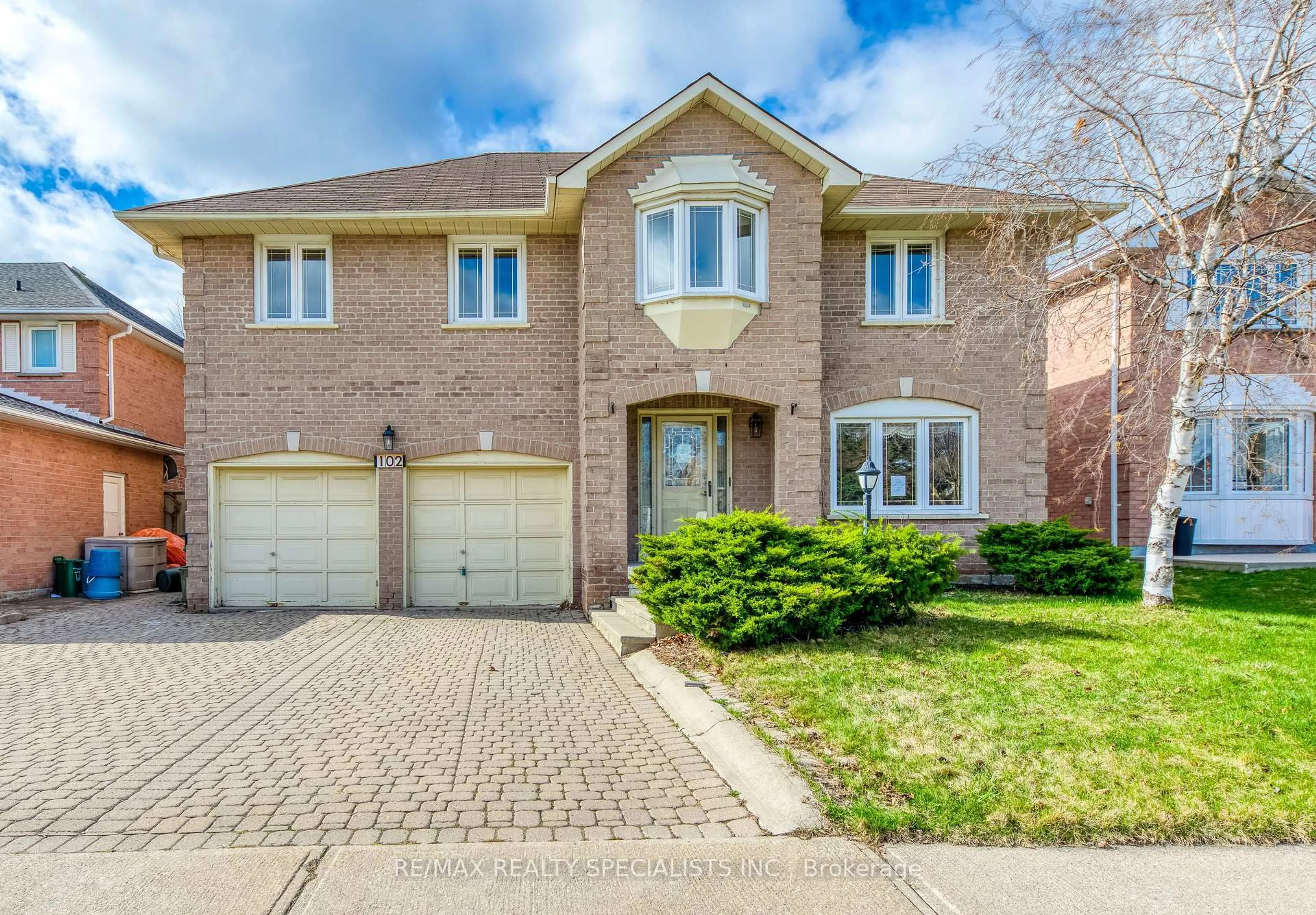 Home with brick exterior material, street for 102 Sunforest Dr, Brampton Ontario L6Z 4B2