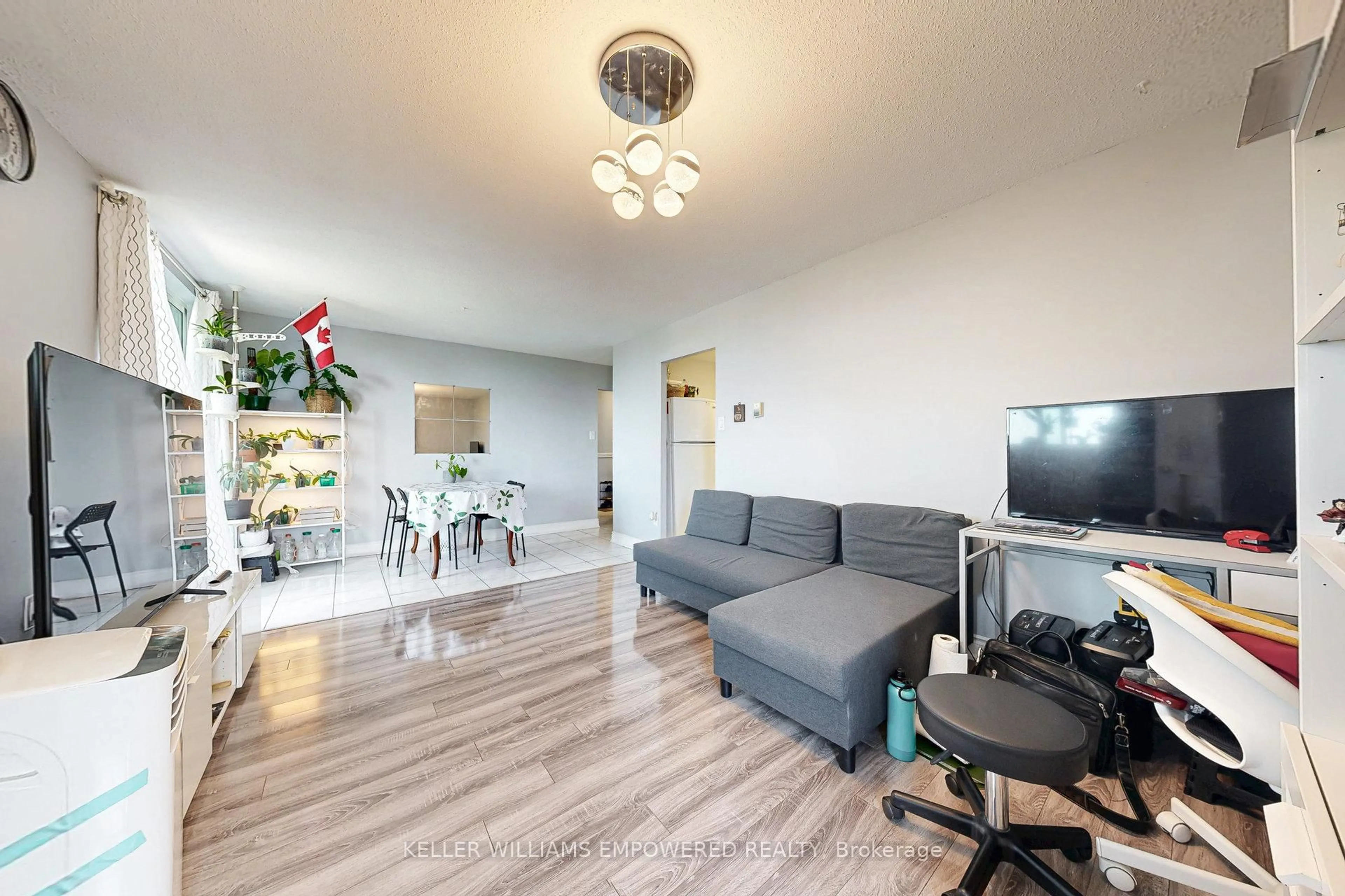 Living room with furniture, wood/laminate floor for 3555 Derry Rd #901, Mississauga Ontario L4T 1B2