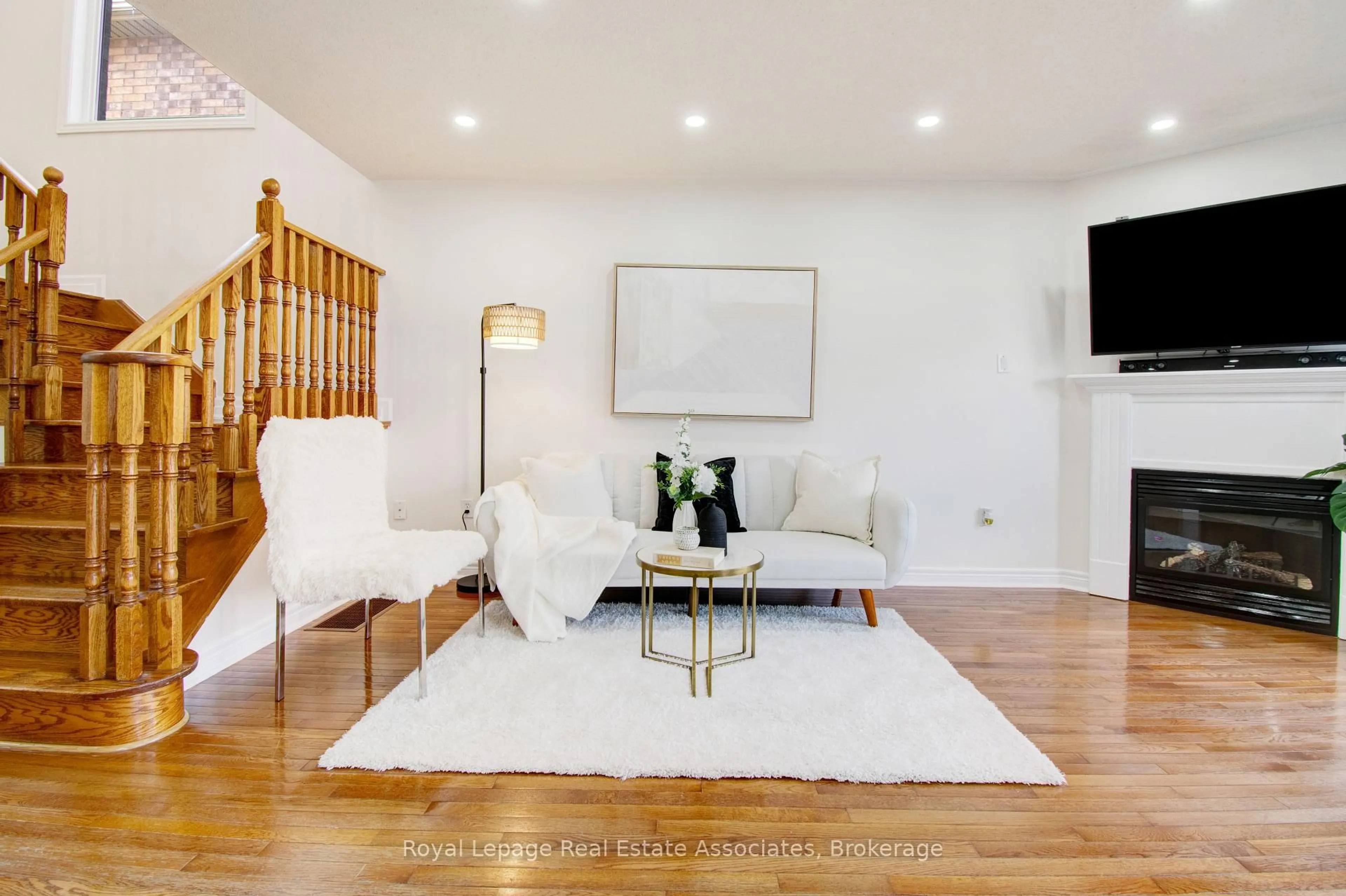 Living room with furniture, wood/laminate floor for 133 Sewells Lane, Brampton Ontario L7A 2Z7