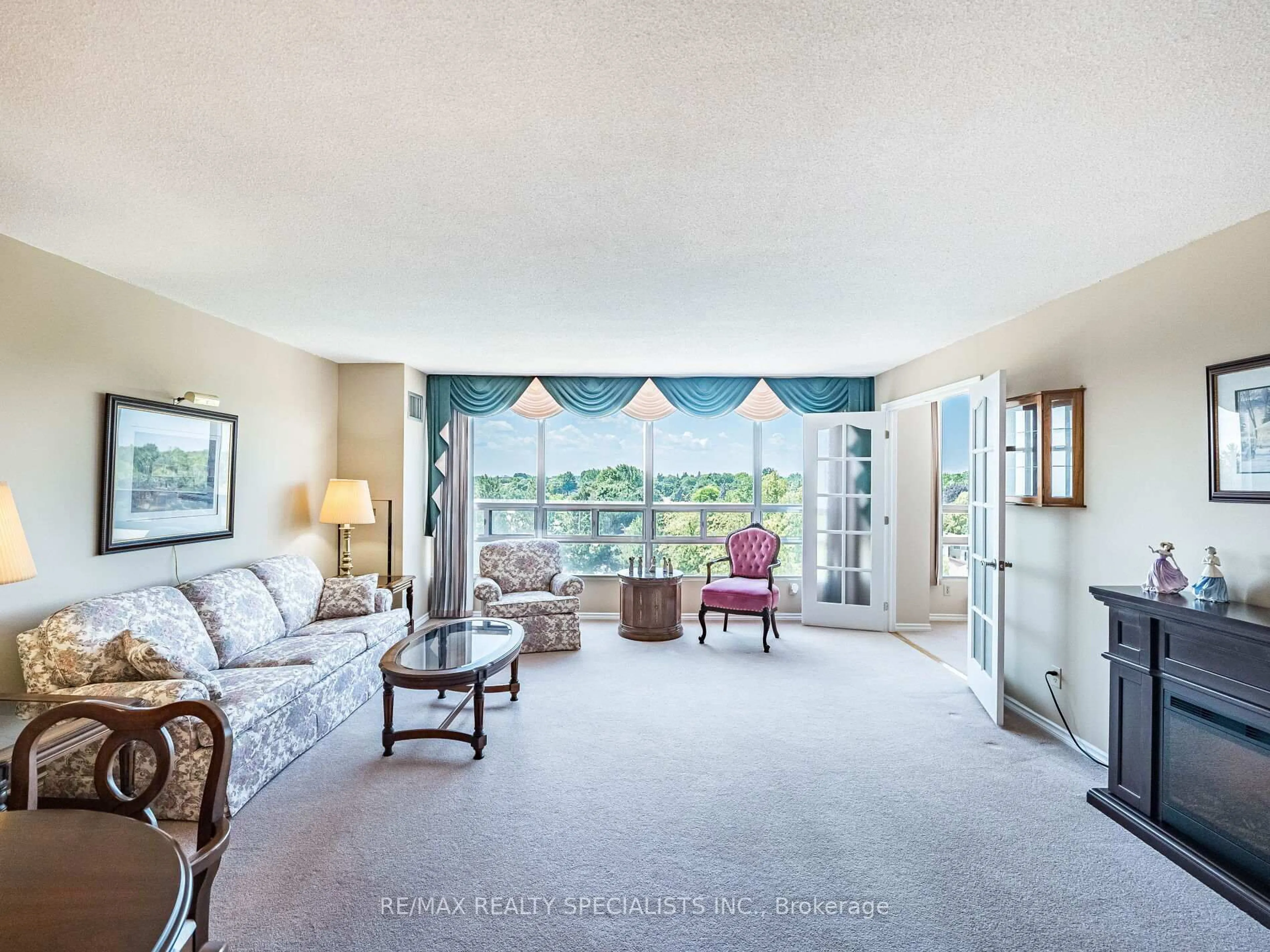 Living room with furniture, unknown for 310 MILL St #606, Brampton Ontario L7C 1P6