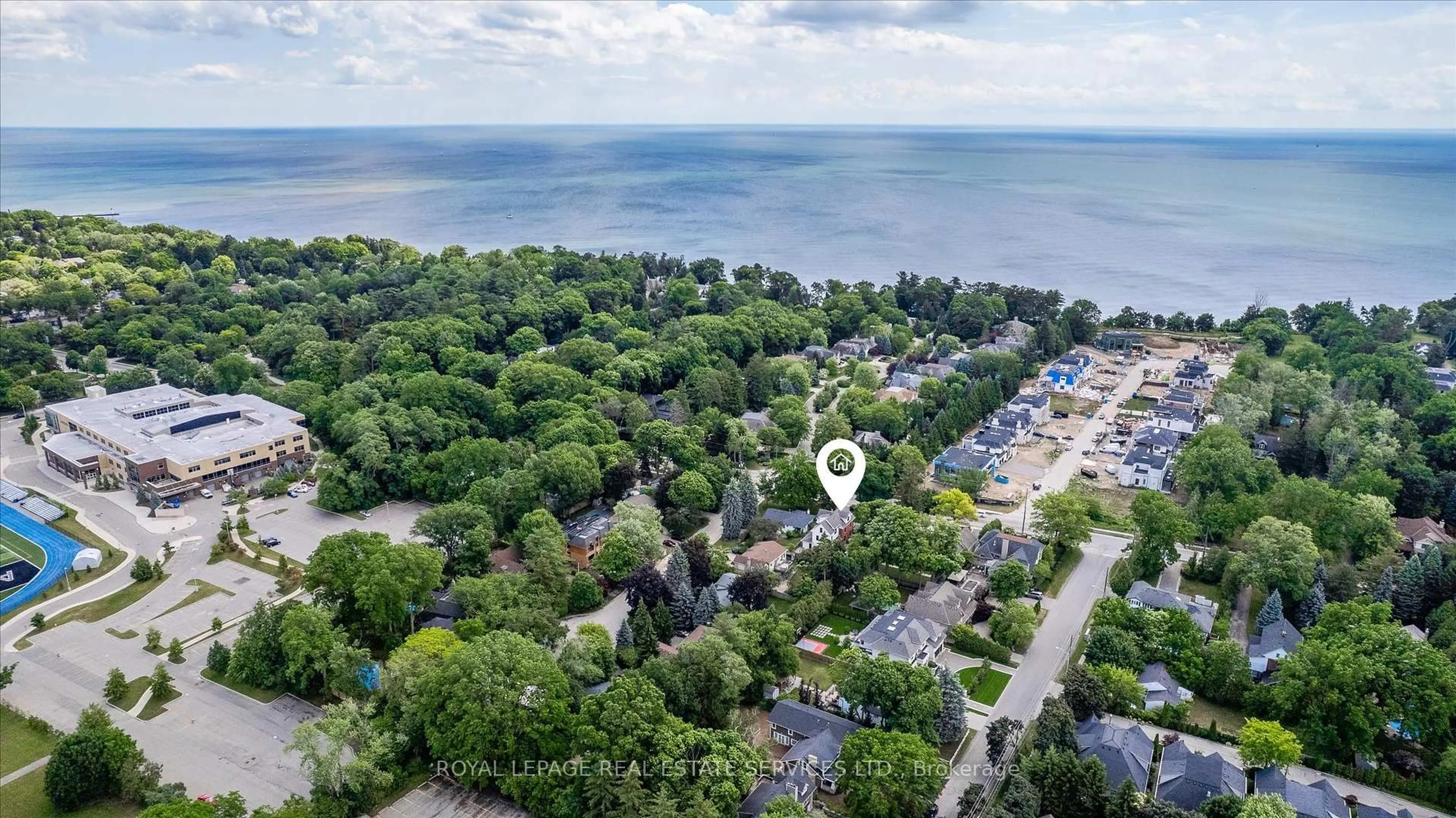 A pic from outside/outdoor area/front of a property/back of a property/a pic from drone, water/lake/river/ocean view for 335 Lakeshore Rd, Oakville Ontario L6K 1G3