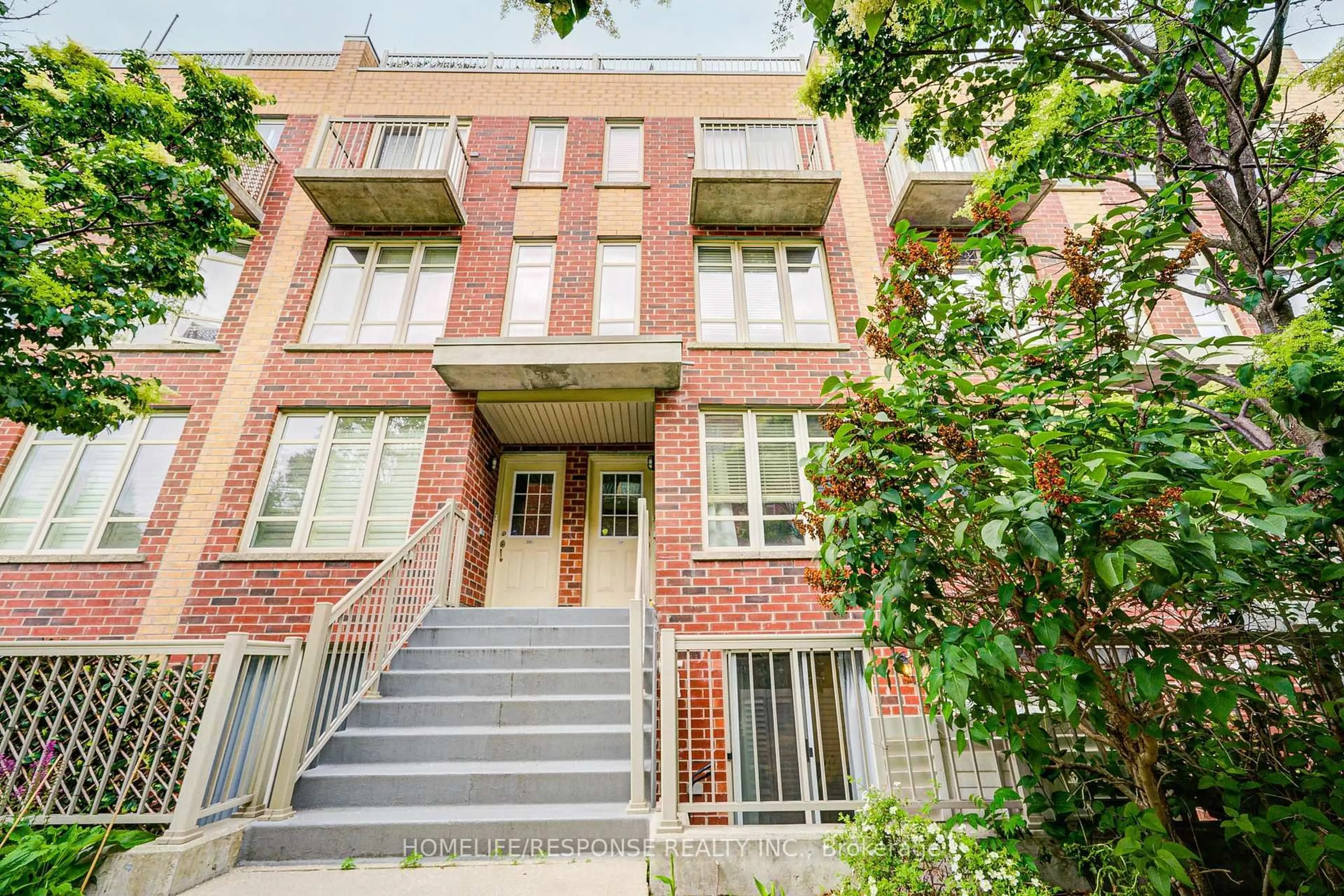 Home with brick exterior material, street for 35 Elsie Lane #149, Toronto Ontario M6P 3N3