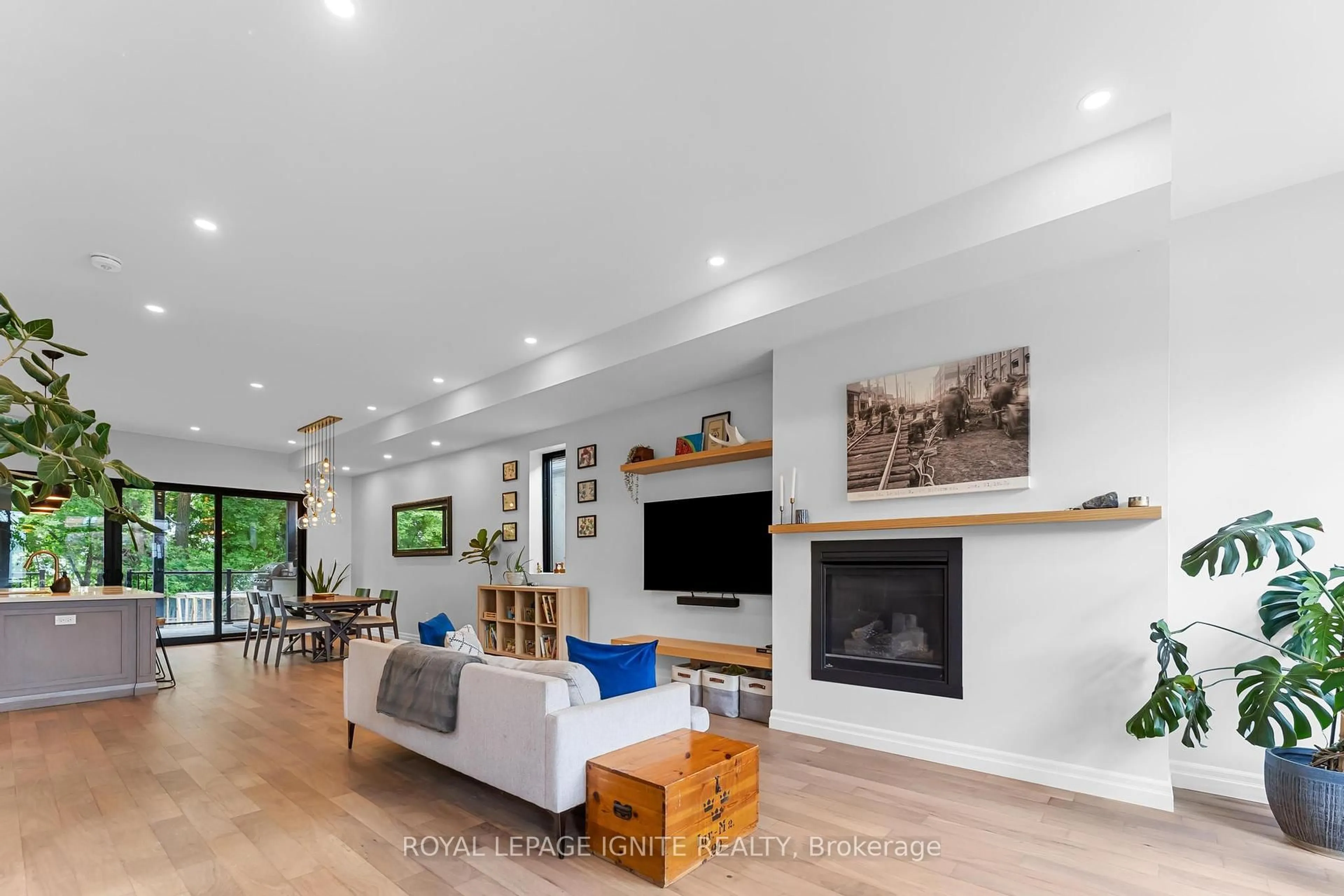 Living room with furniture, wood/laminate floor for 22 Spears St, Toronto Ontario M6N 3X7