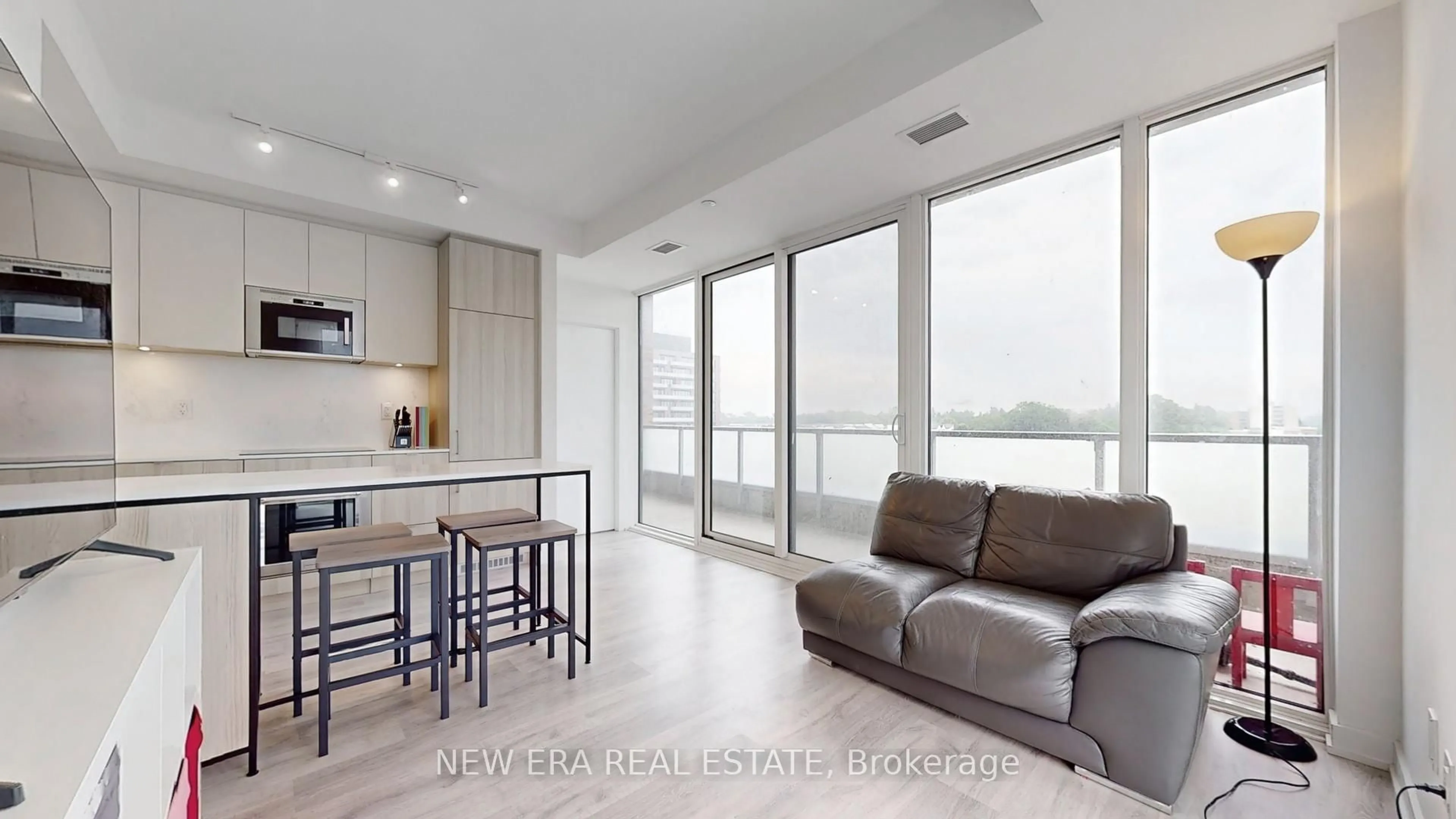 Living room with furniture, wood/laminate floor for 215 Lakeshore Rd #521, Mississauga Ontario L5H 0A7