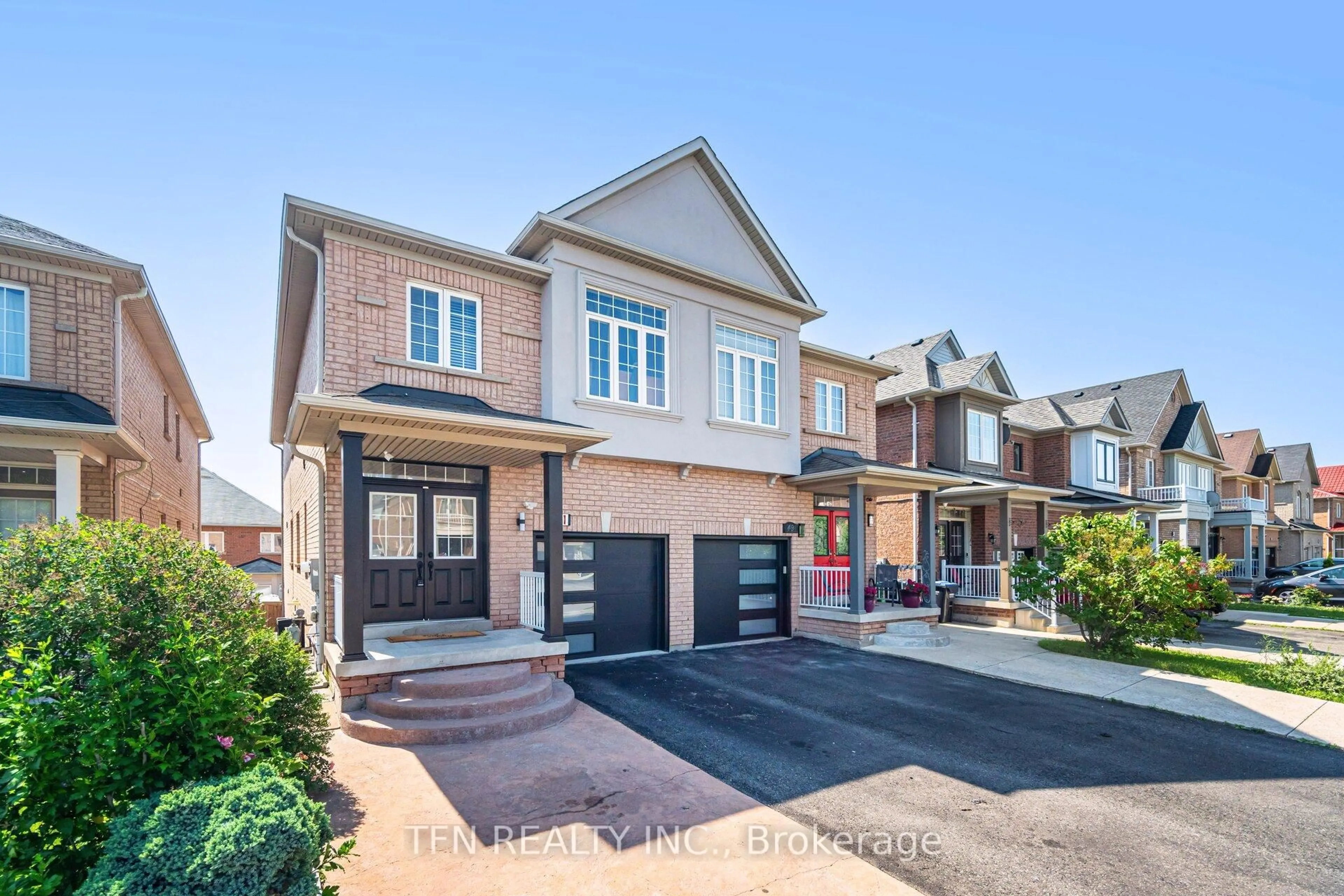 Home with brick exterior material, street for 51 Portrush Tr, Brampton Ontario L6X 0R2
