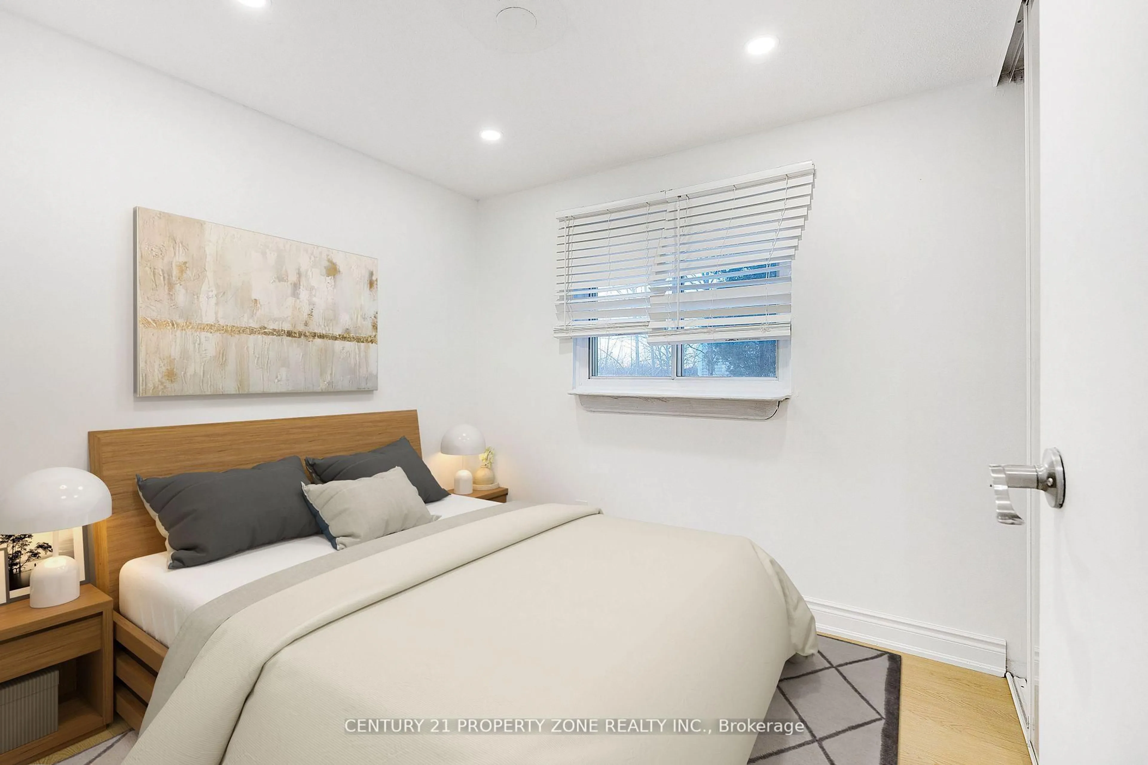 Bedroom with bed, wood/laminate floor for 96 Centre St, Brampton Ontario L6V 2Z3