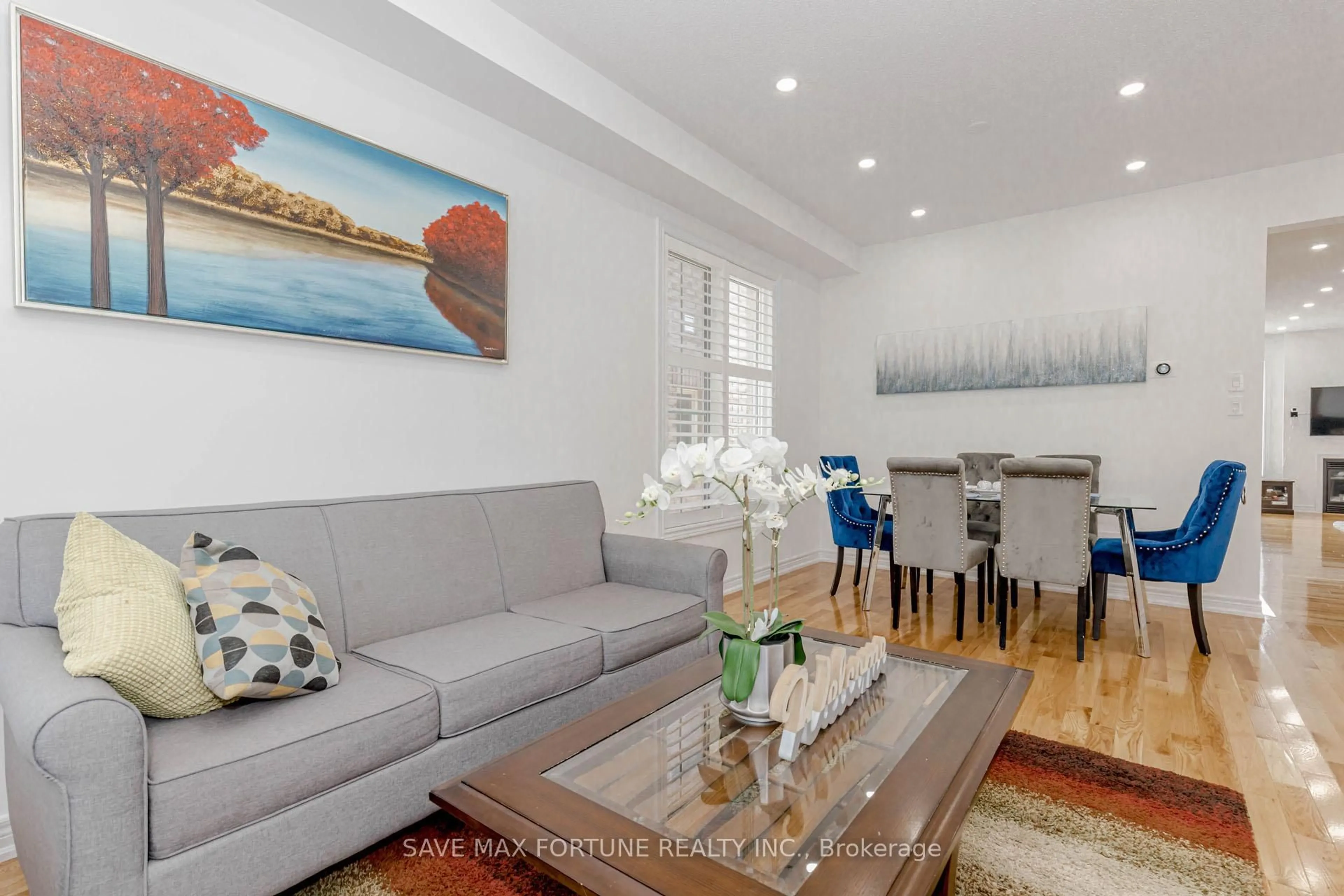 Living room with furniture, wood/laminate floor for 53 Chesterwood Cres, Brampton Ontario L6Y 0Z4