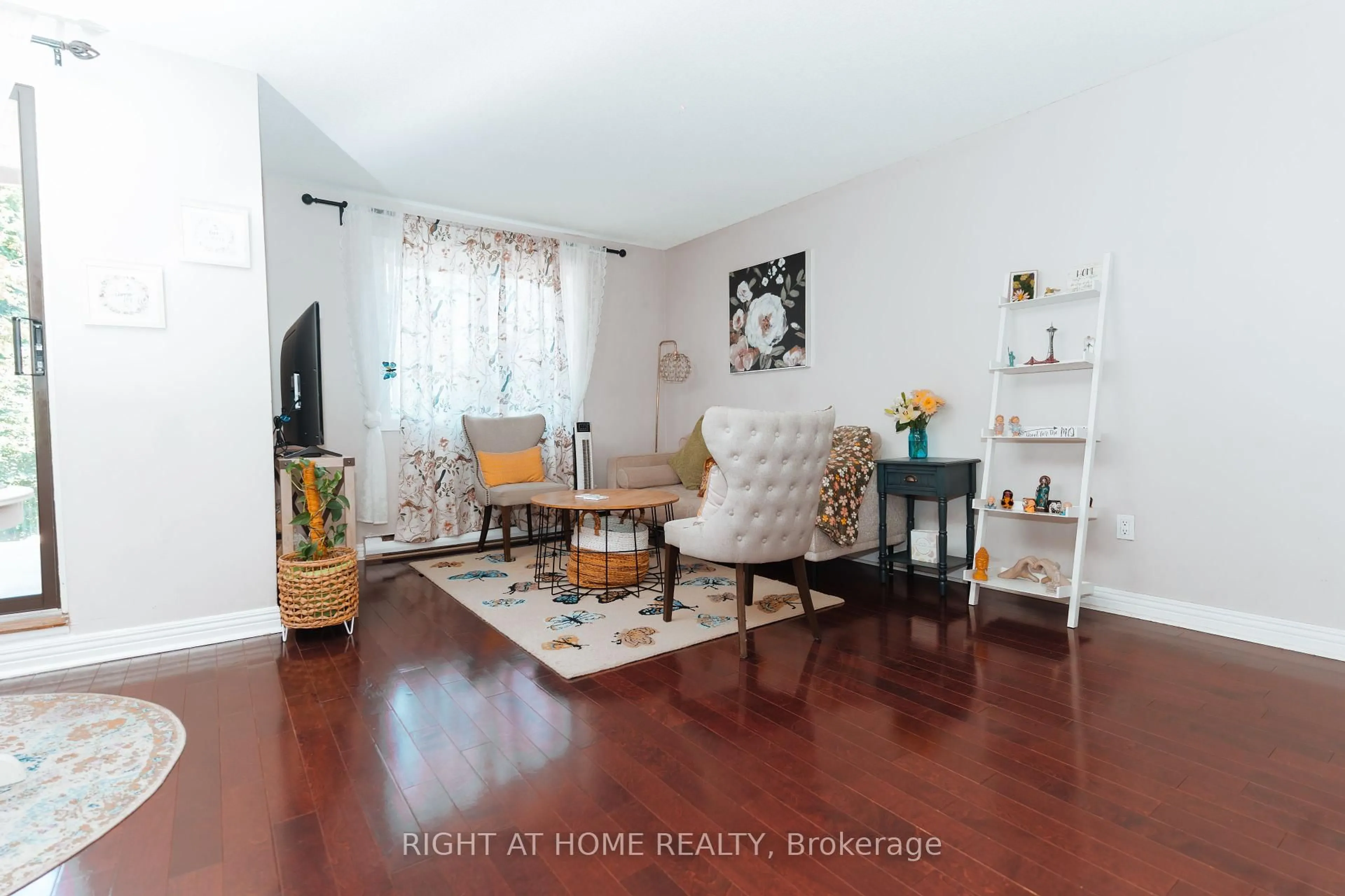 Living room with furniture, wood/laminate floor for 1030 Falgarwood Dr #56, Oakville Ontario L6H 2P5