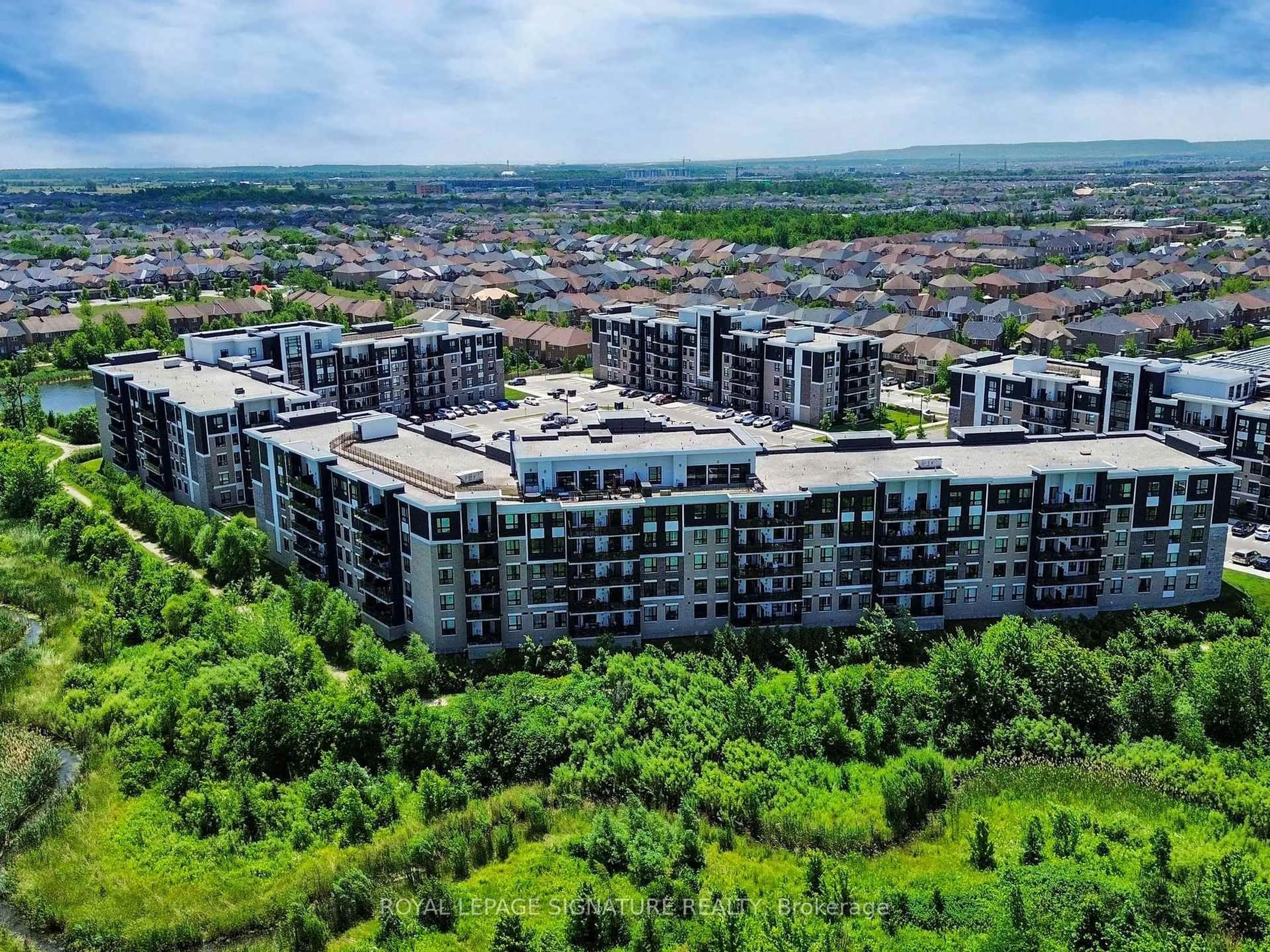A pic from outside/outdoor area/front of a property/back of a property/a pic from drone, unknown for 630 Sauve St #215, Milton Ontario L9T 9A6