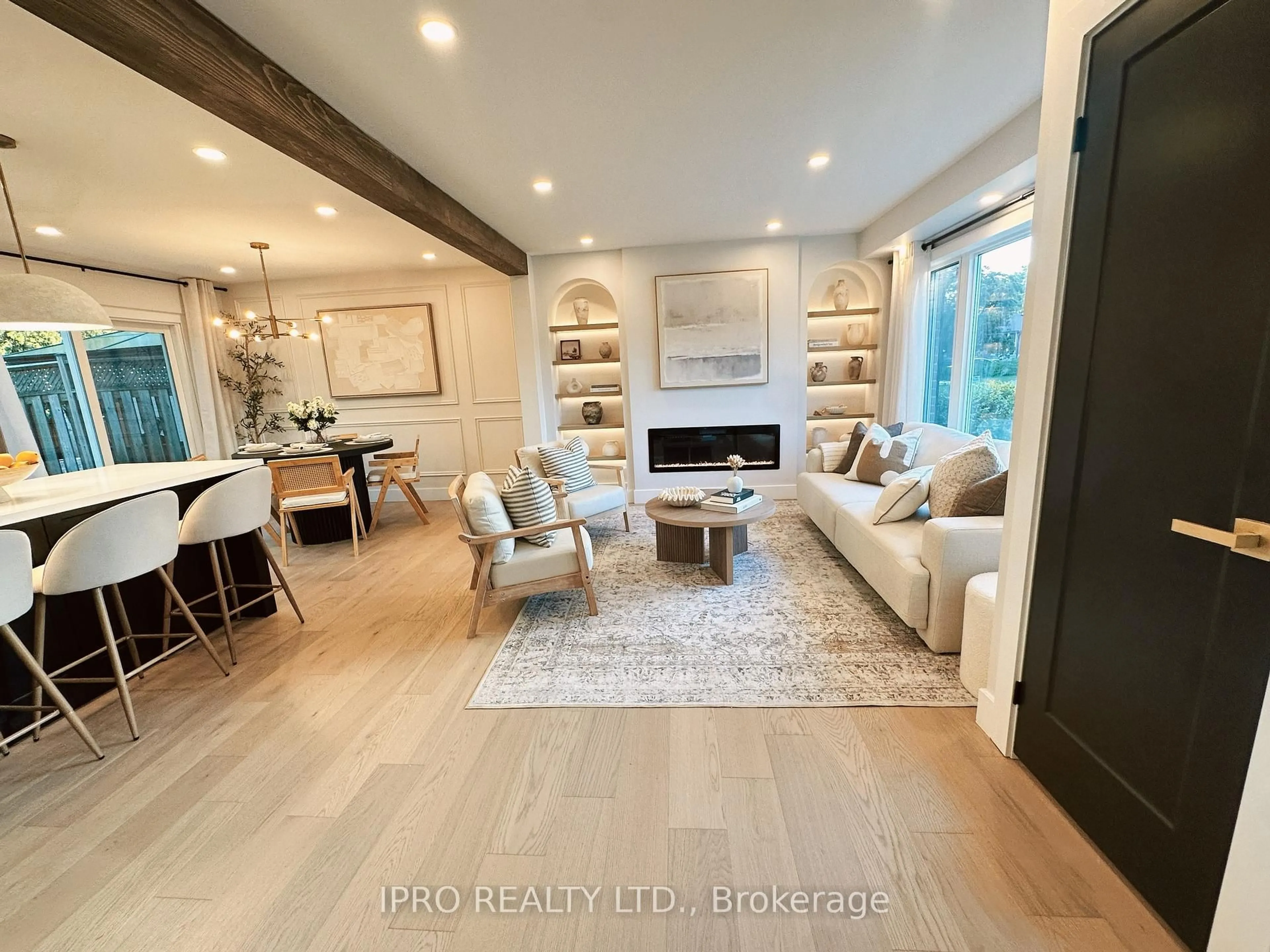 Living room with furniture, wood/laminate floor for 92 Forsythia Rd, Brampton Ontario L6T 2G3