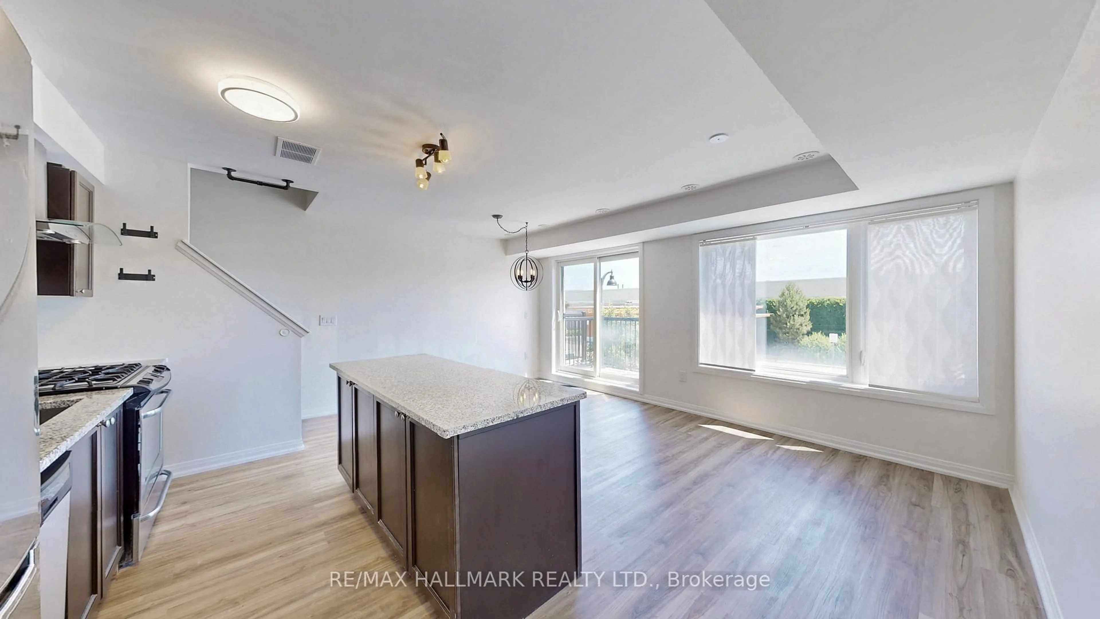 Open concept kitchen, wood/laminate floor for 173 William Duncan Rd #4, Toronto Ontario M3K 0B7