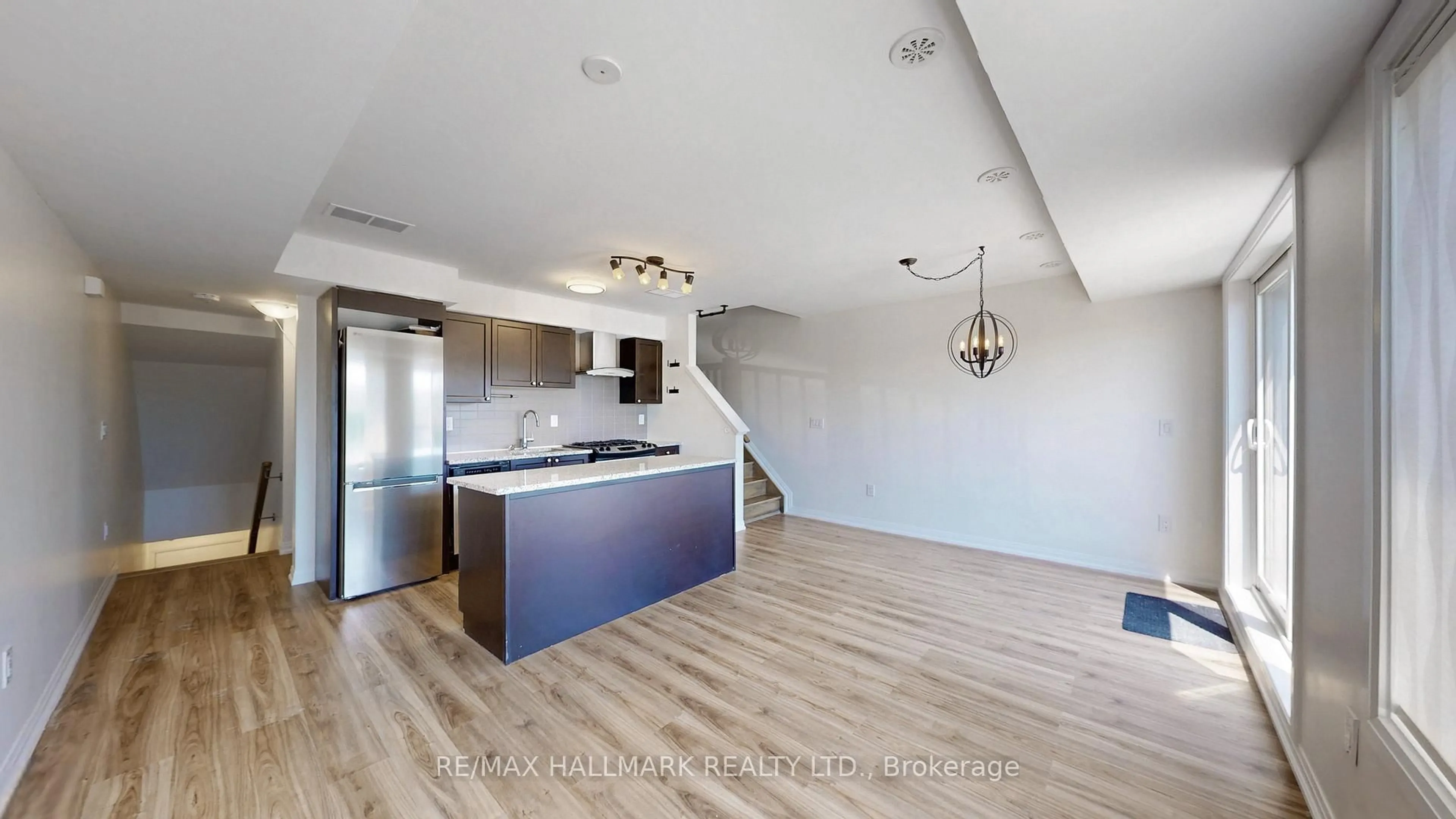 Open concept kitchen, wood/laminate floor for 173 William Duncan Rd #4, Toronto Ontario M3K 0B7