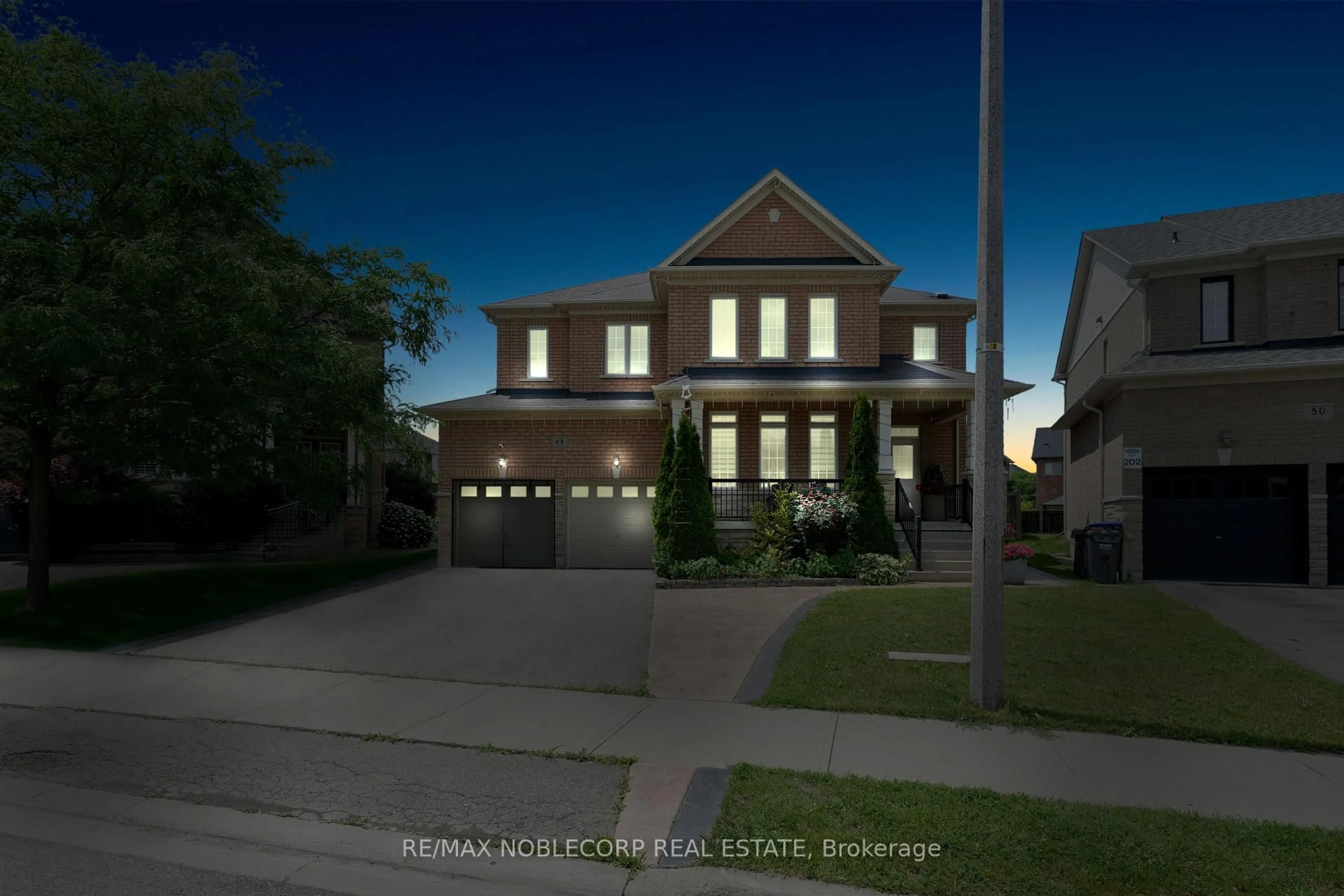 Home with brick exterior material, street for 48 Monabelle Cres, Brampton Ontario L6P 1Z3
