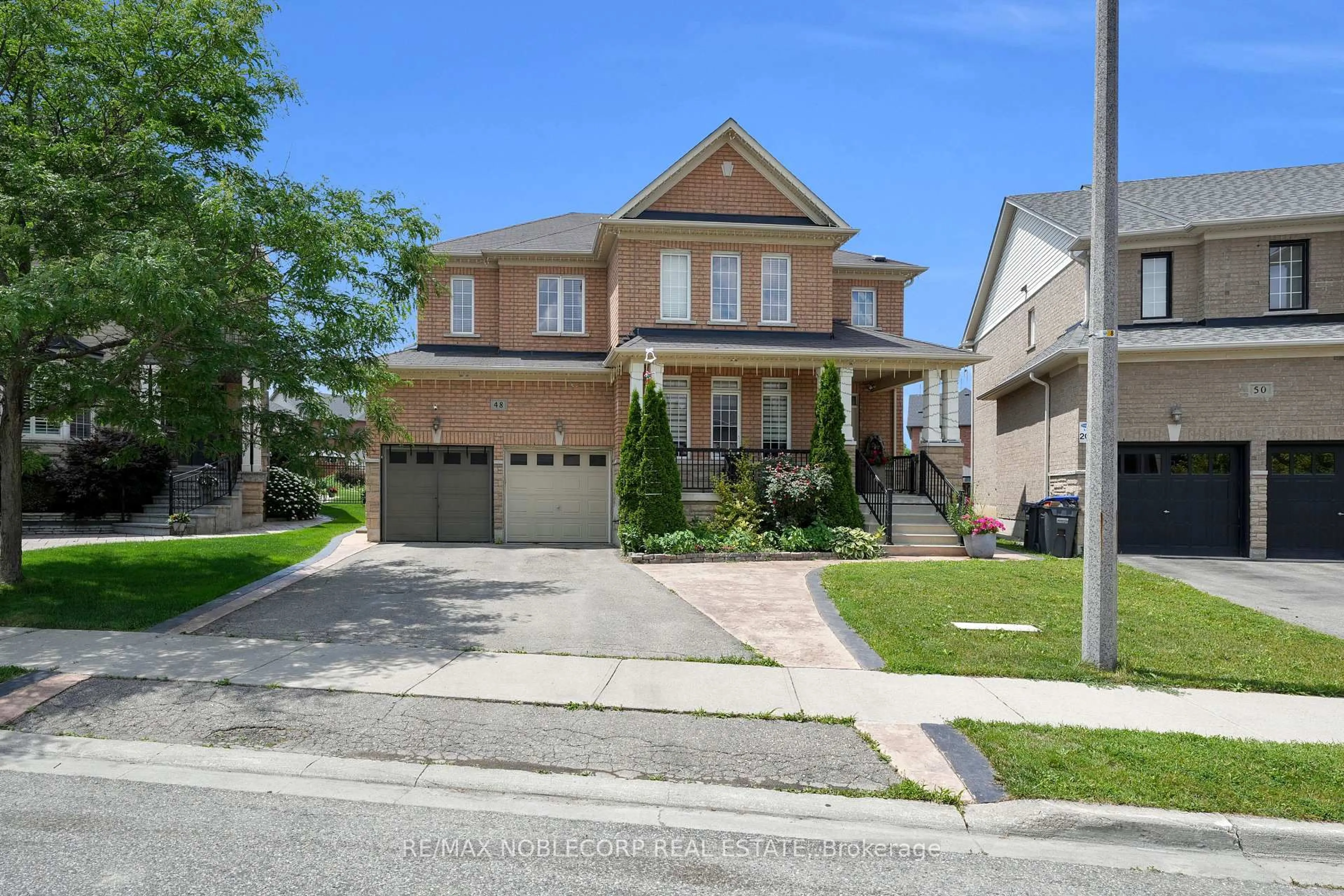 Home with brick exterior material, street for 48 Monabelle Cres, Brampton Ontario L6P 1Z3