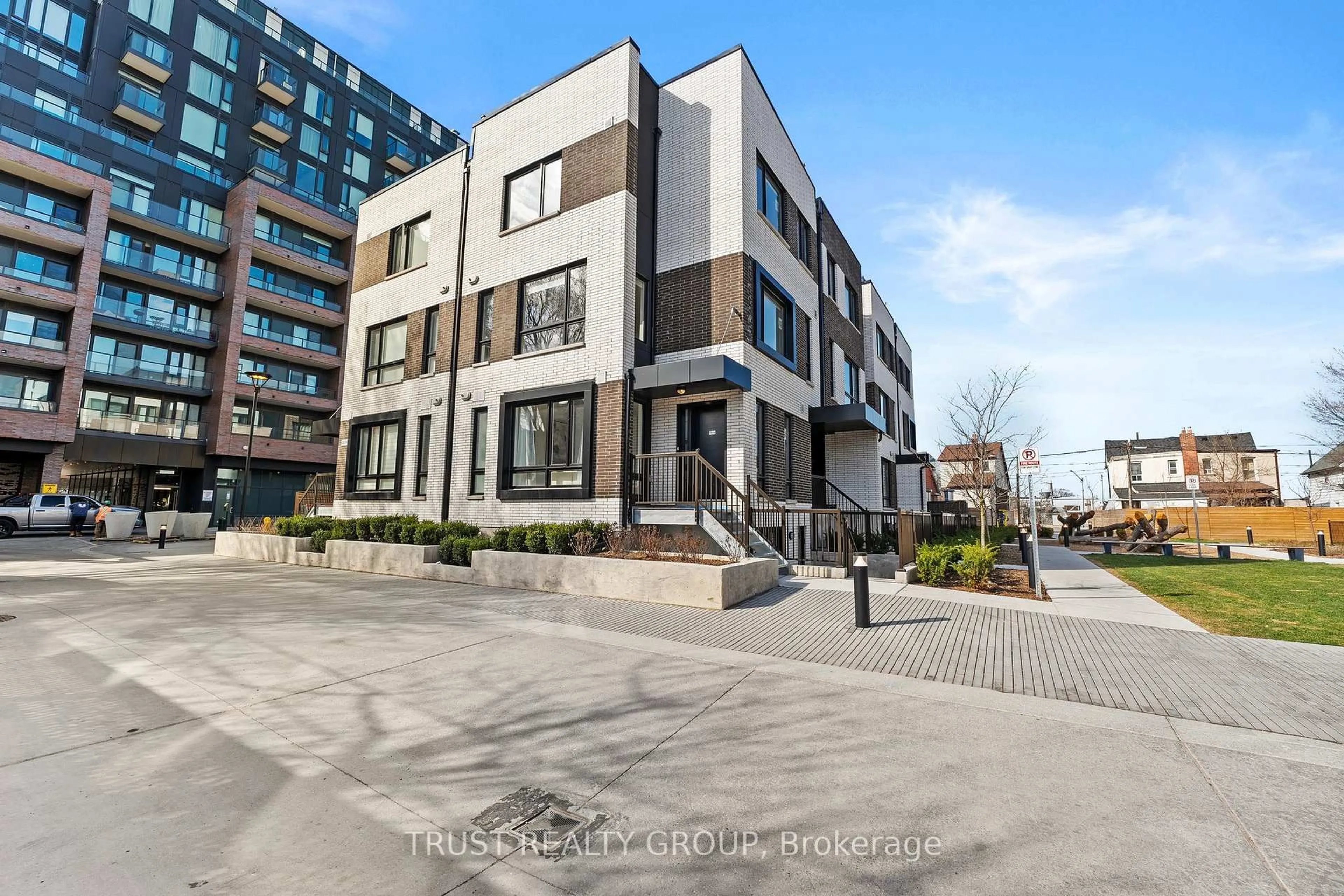 A pic from outside/outdoor area/front of a property/back of a property/a pic from drone, street for 10 Ed Clark Gdns #TH16, Toronto Ontario M6N 0C1