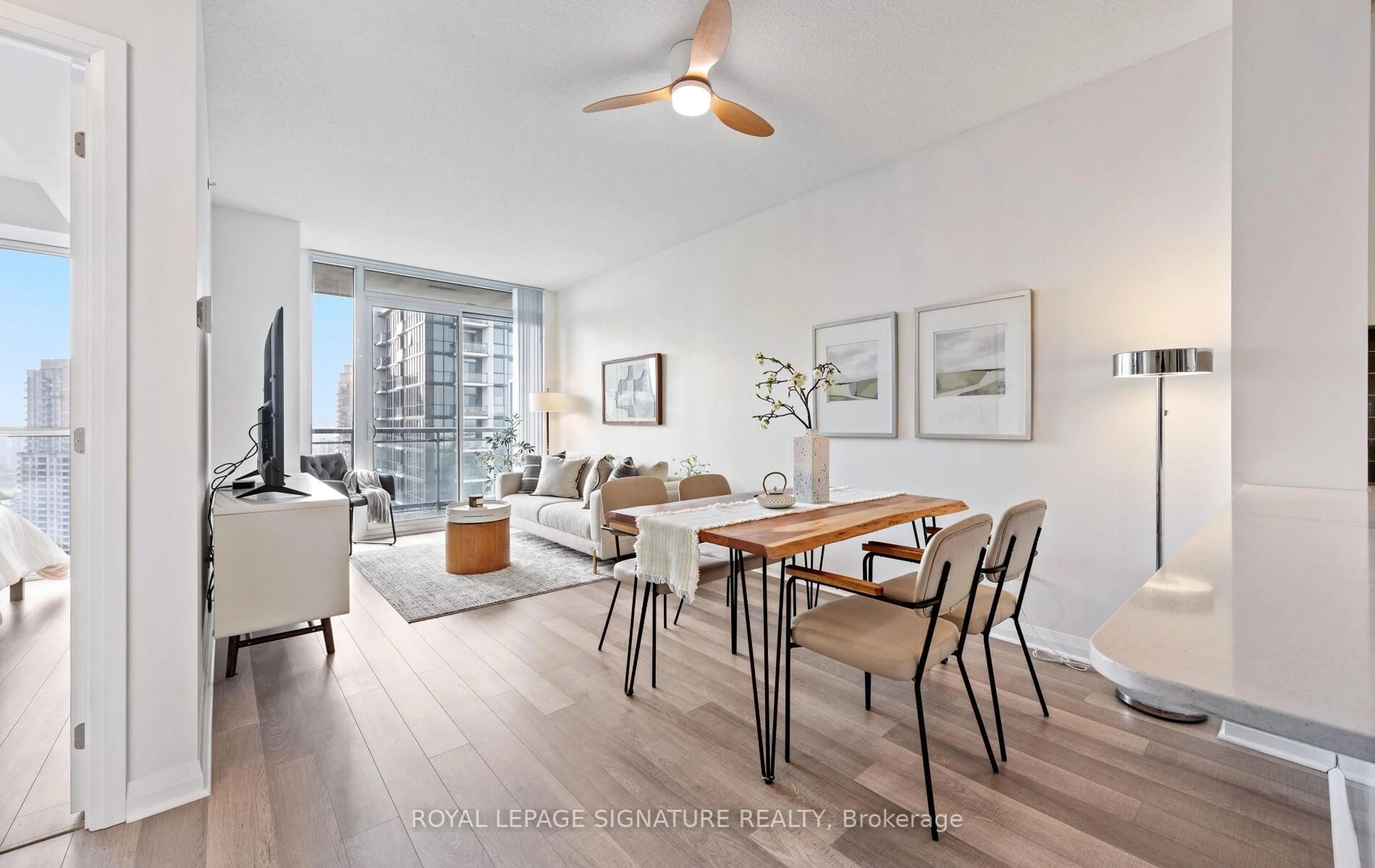 Living room with furniture, wood/laminate floor for 5025 Four Springs Ave #2404, Mississauga Ontario L5R 0G5
