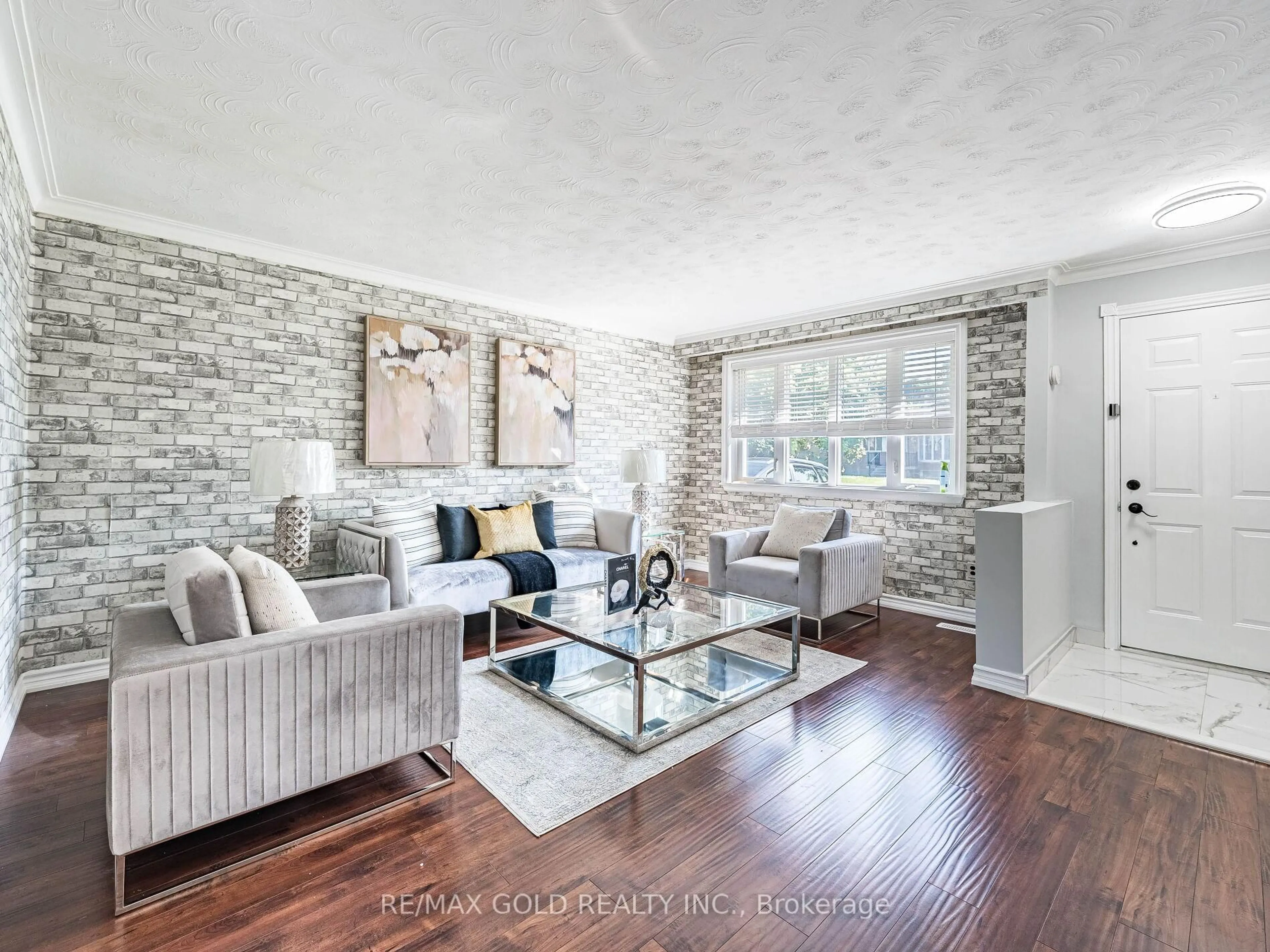 Living room with furniture, wood/laminate floor for 42 Gretna Dr, Brampton Ontario L6X 2E7