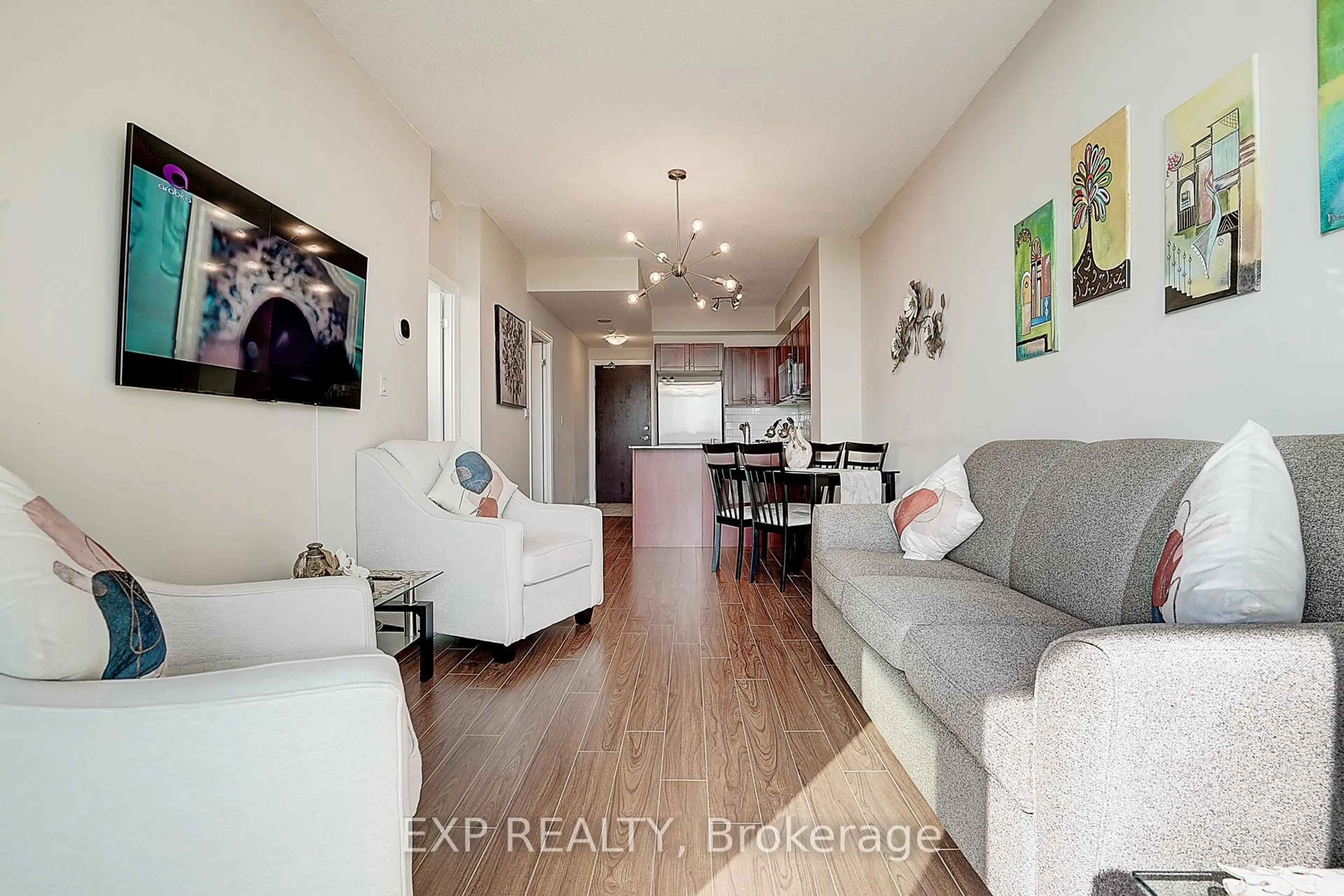 Living room with furniture, wood/laminate floor for 1359 Rathburn Rd #1111, Mississauga Ontario L4W 5P7