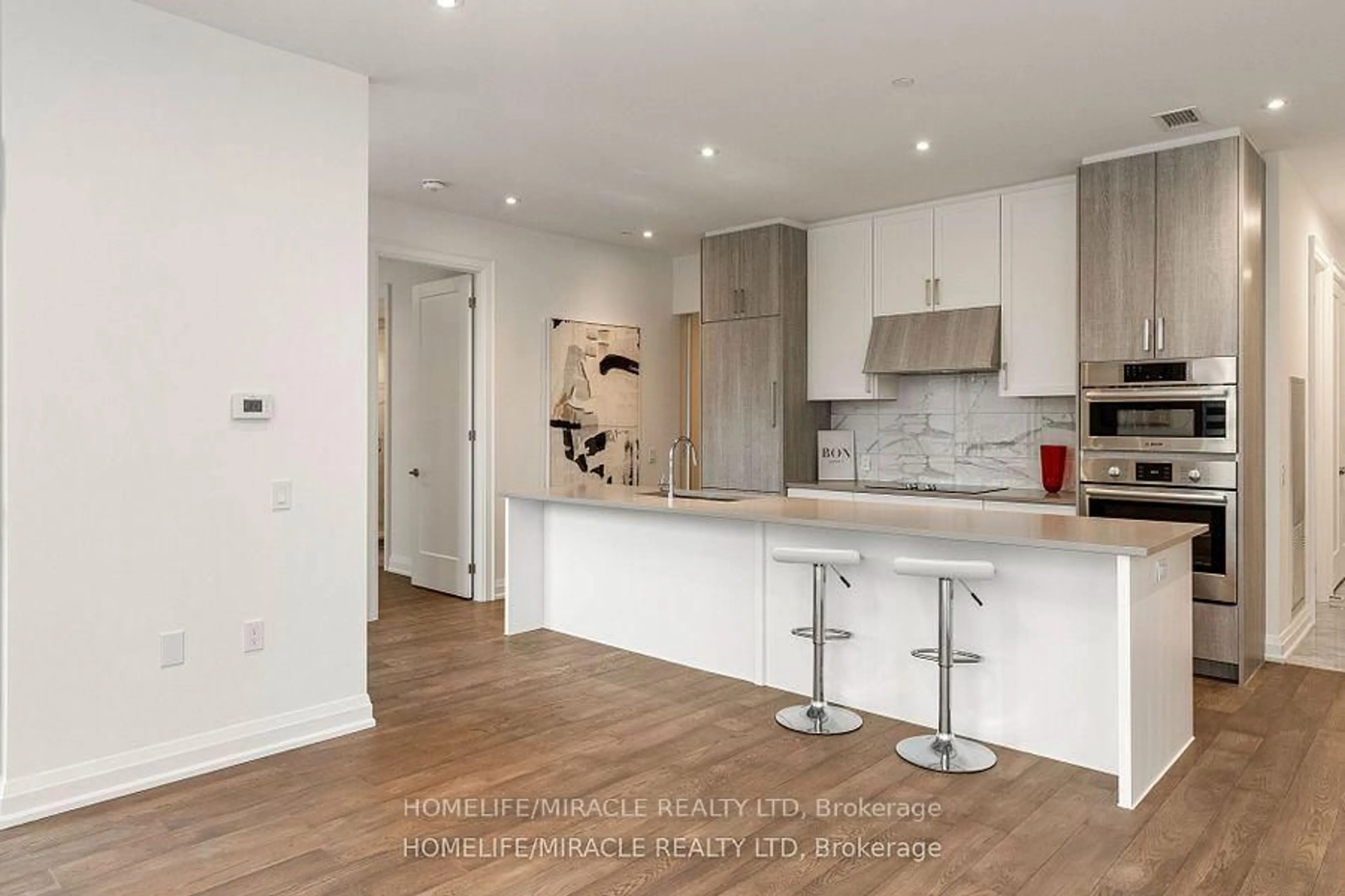 Open concept kitchen, wood/laminate floor for 42 Mill St #414, Halton Hills Ontario L7G 0P9