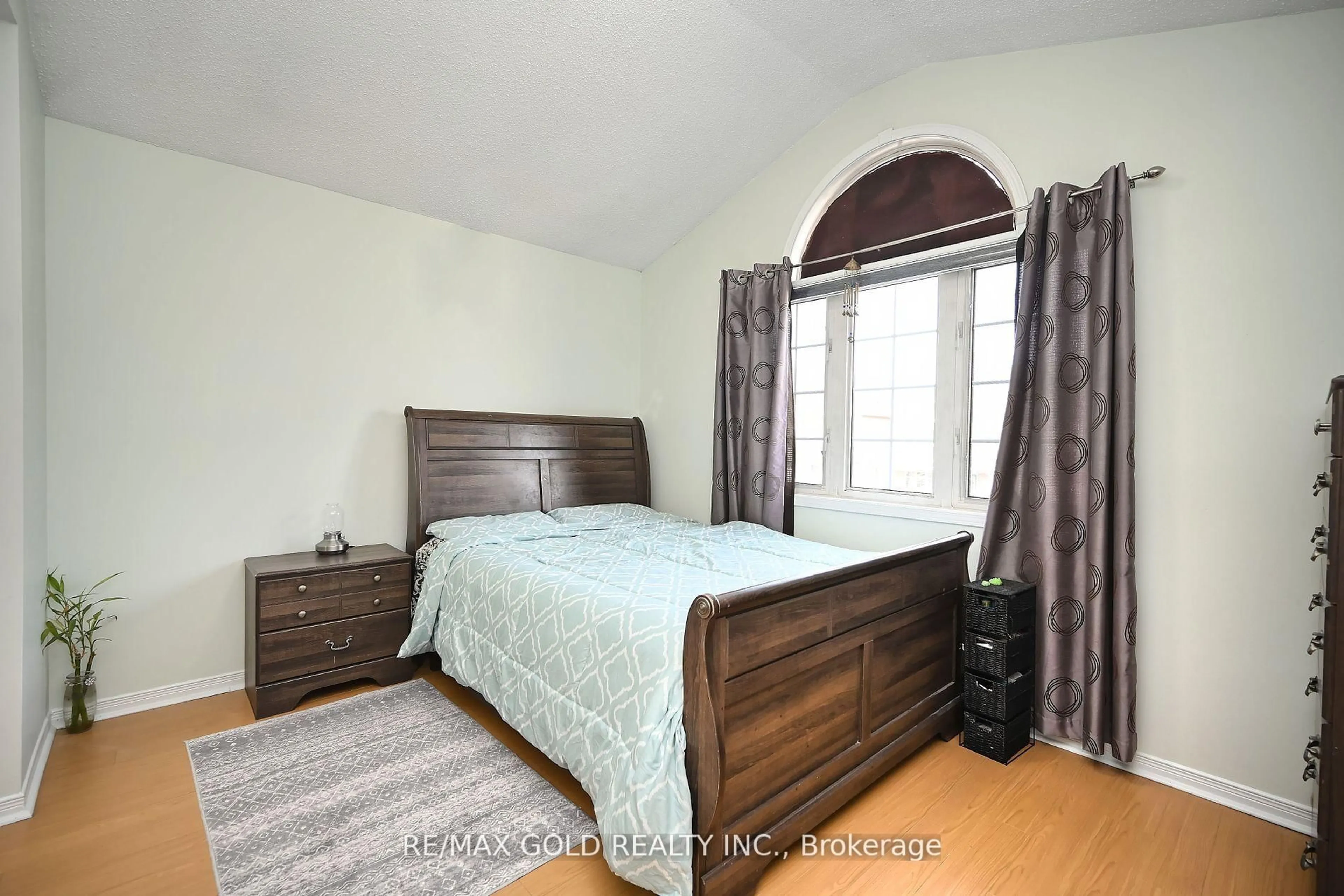 Bedroom with bed, wood/laminate floor for 34 Saintsbury Cres, Brampton Ontario L6R 2W3