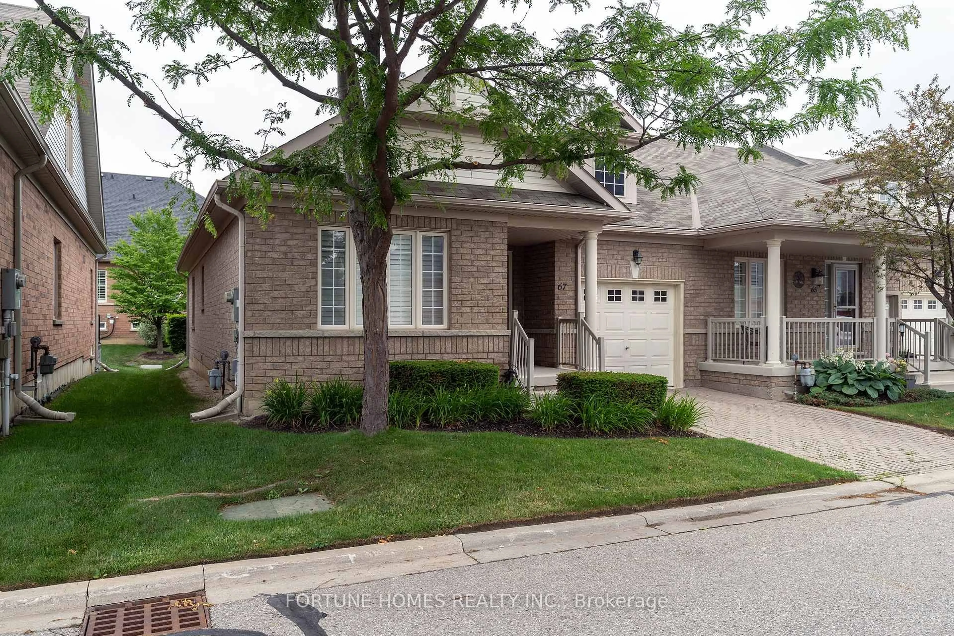 Home with brick exterior material, street for 67 Locust Dr, Brampton Ontario L6R 0W2
