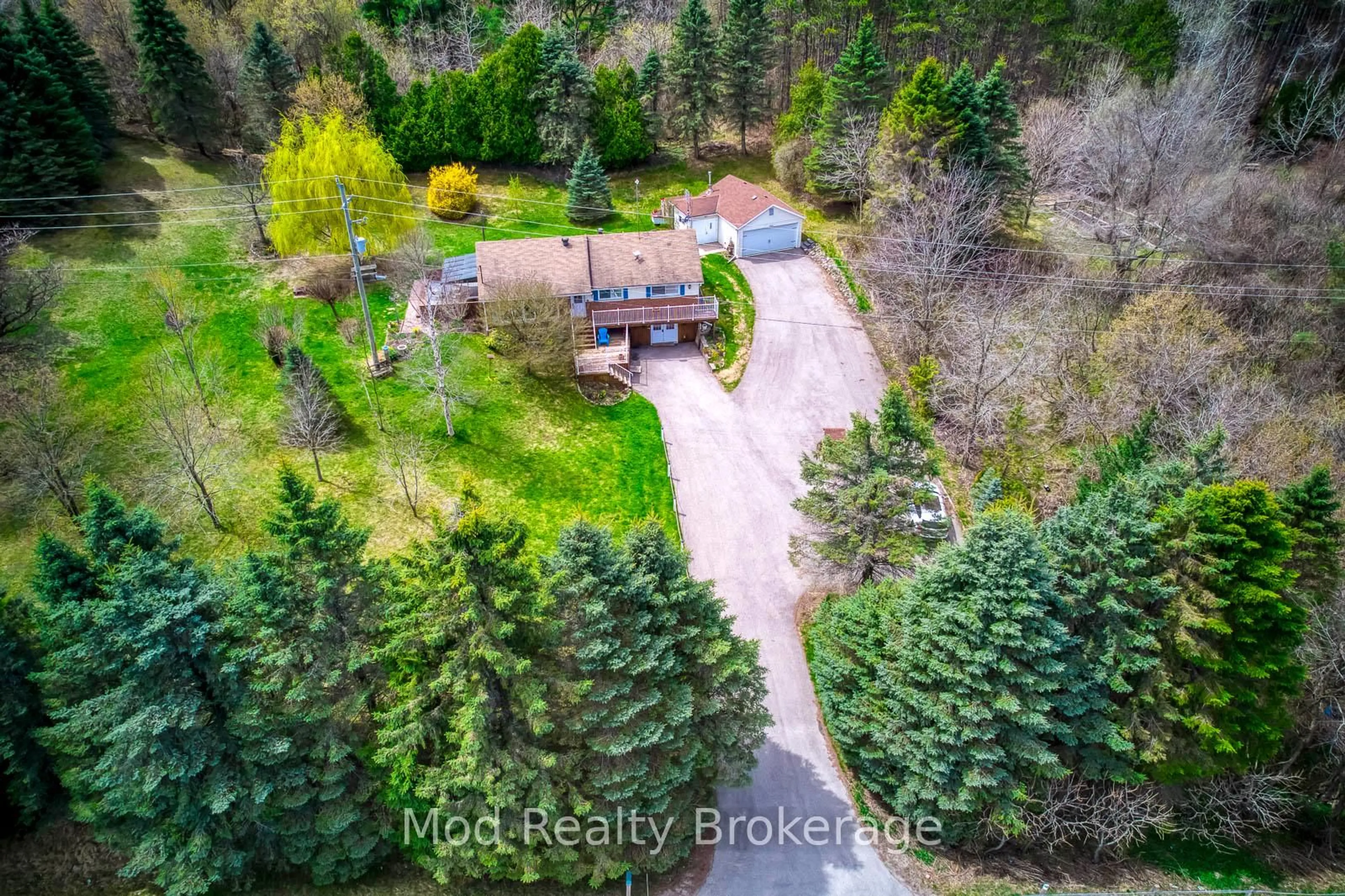A pic from outside/outdoor area/front of a property/back of a property/a pic from drone, forest/trees view for 12638 4 Line, Halton Hills Ontario L7J 2M1
