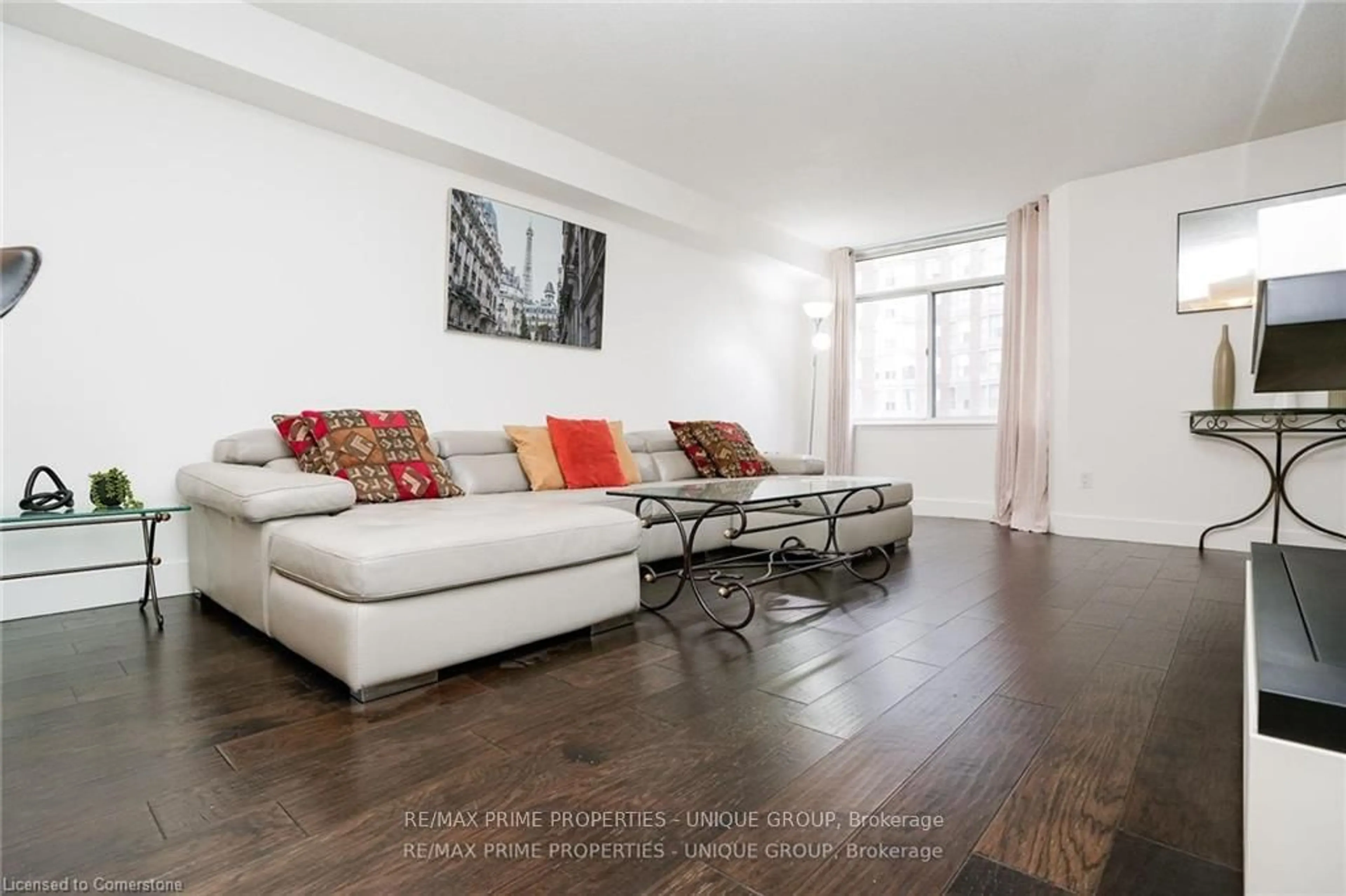 Living room with furniture, wood/laminate floor for 300 Webb Dr #706, Mississauga Ontario L5B 3W3