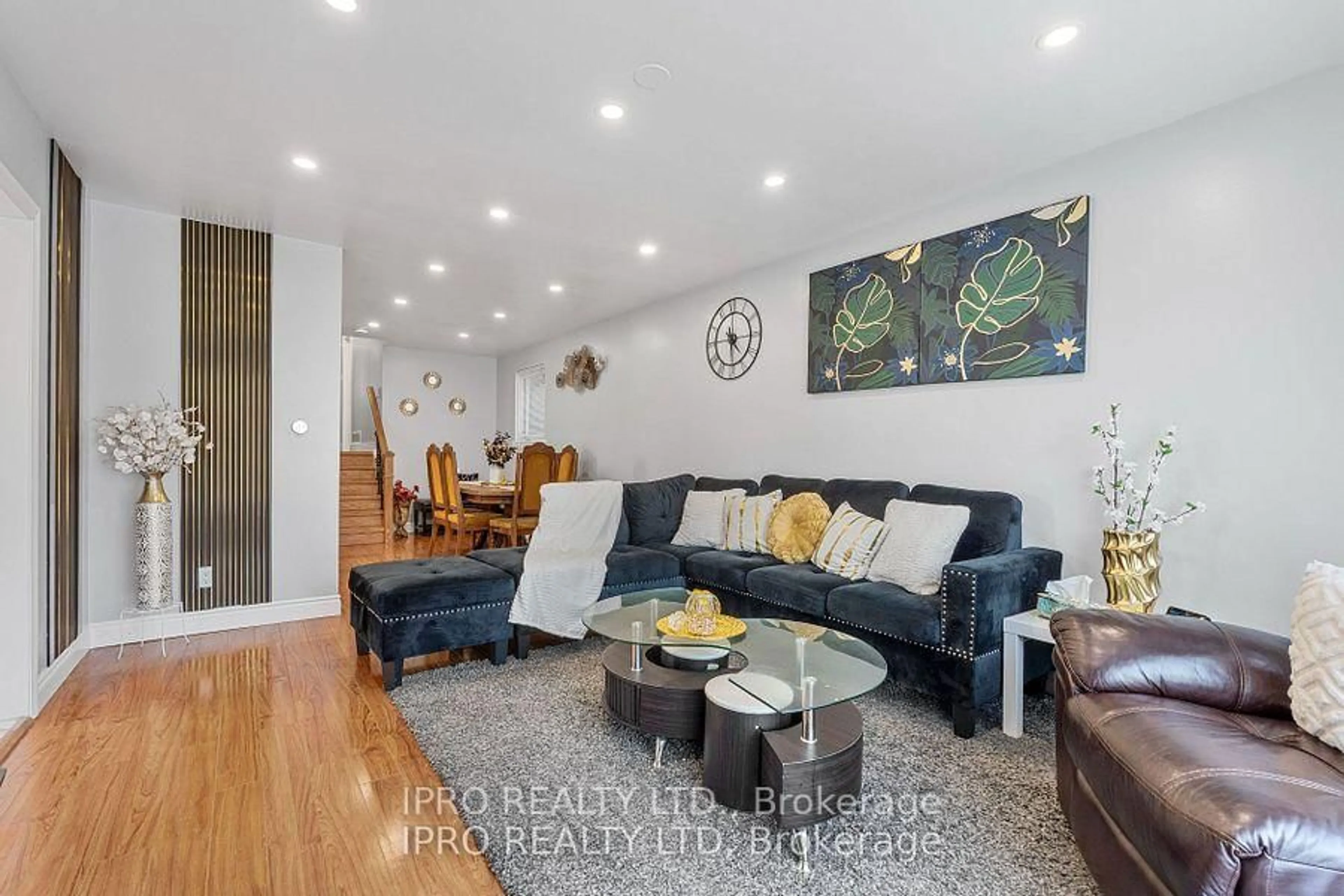 Living room with furniture, wood/laminate floor for 58 Doncaster Dr, Brampton Ontario L6T 1T1