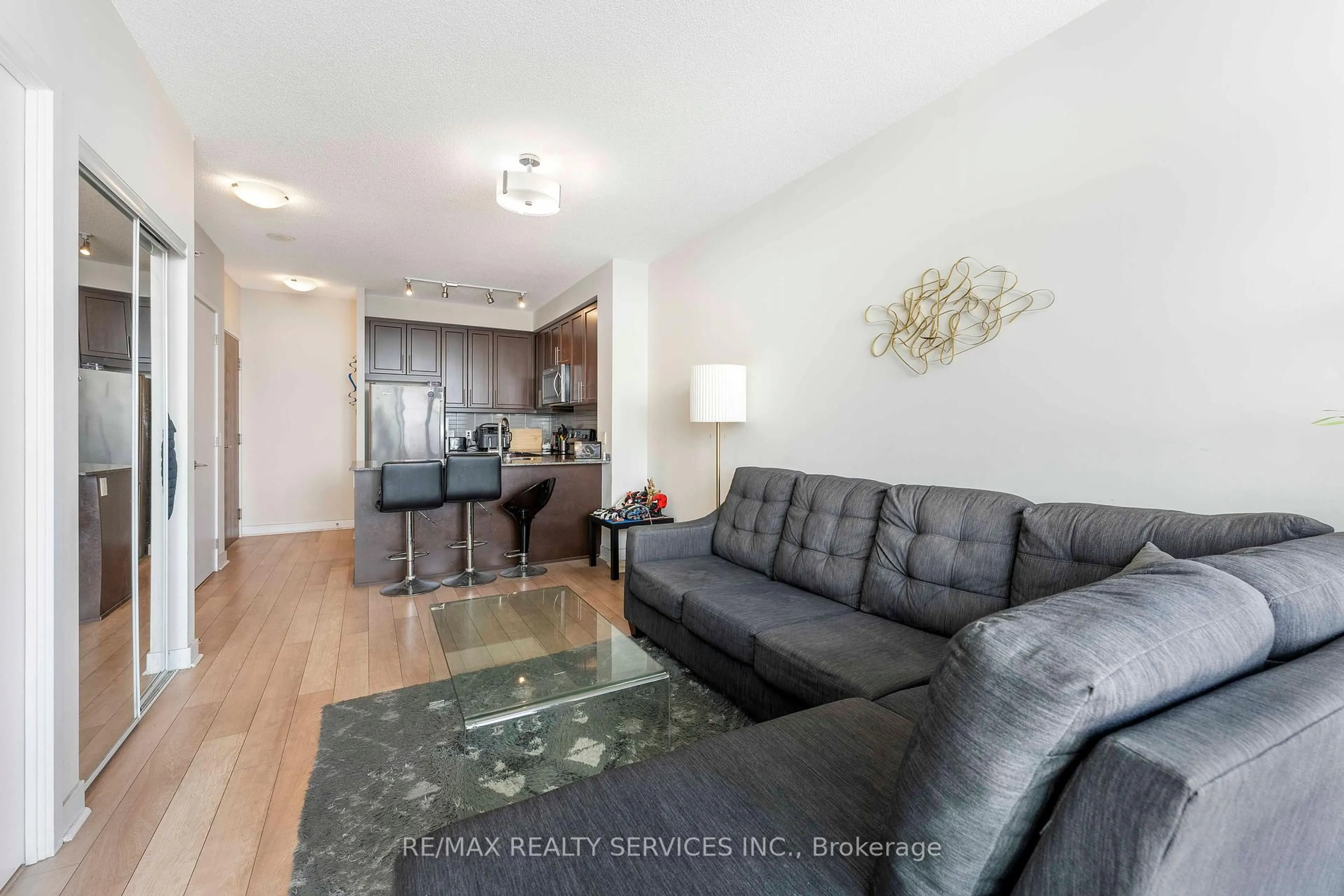Living room with furniture, wood/laminate floor for 3975 Grand Park Dr #1506, Mississauga Ontario L5B 0K4