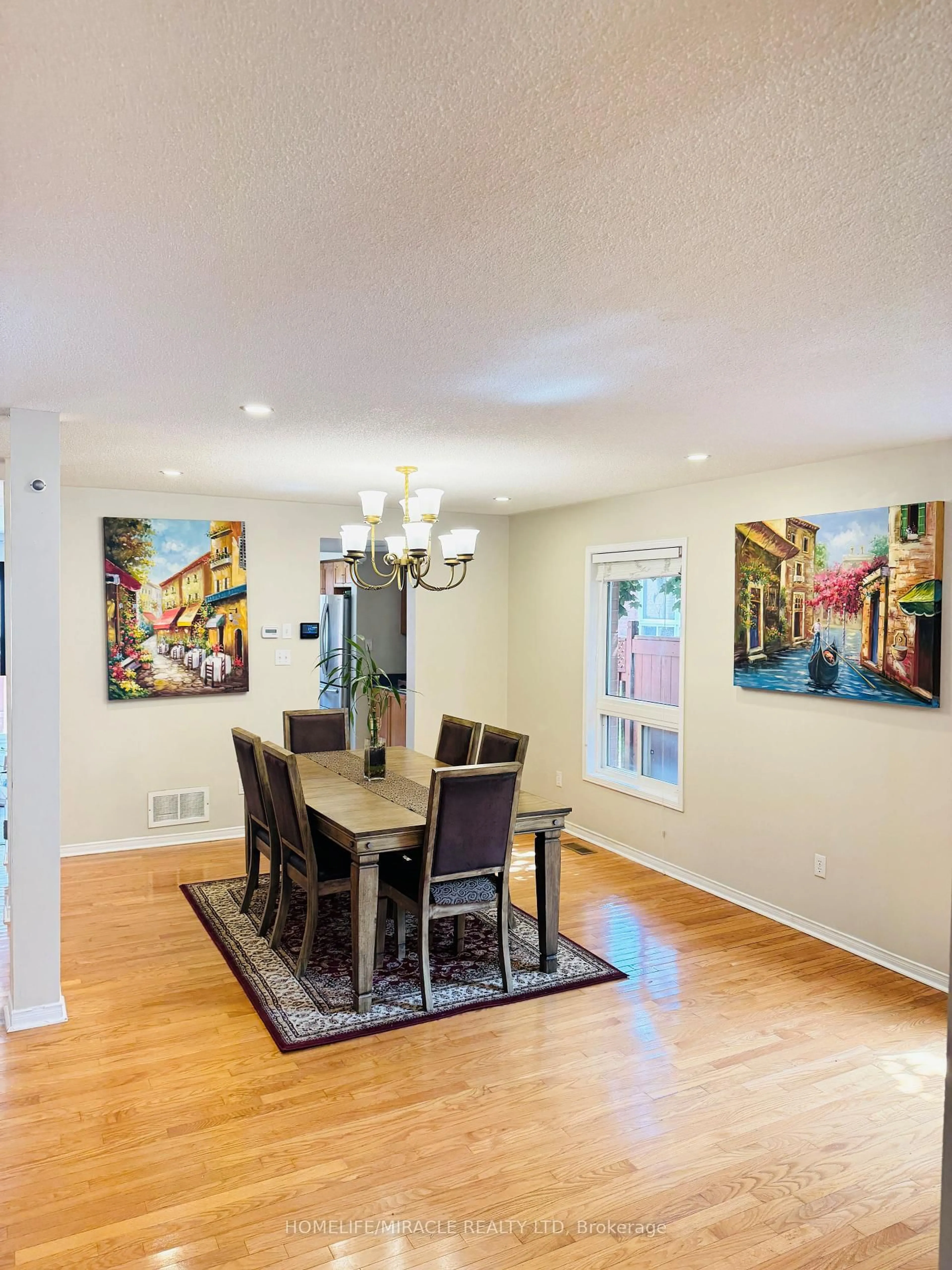 Dining room, wood/laminate floor for 65 Fairhill Ave, Brampton Ontario L7A 2E8